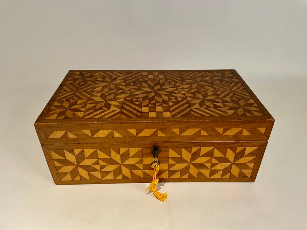 Wonderful 19th century American box with intricate and beautiful geometric inlay. This was created by a true craftsman. Interior painted with removable sectioned tray. 
15.75 inches wide 9 deep 6.2 high