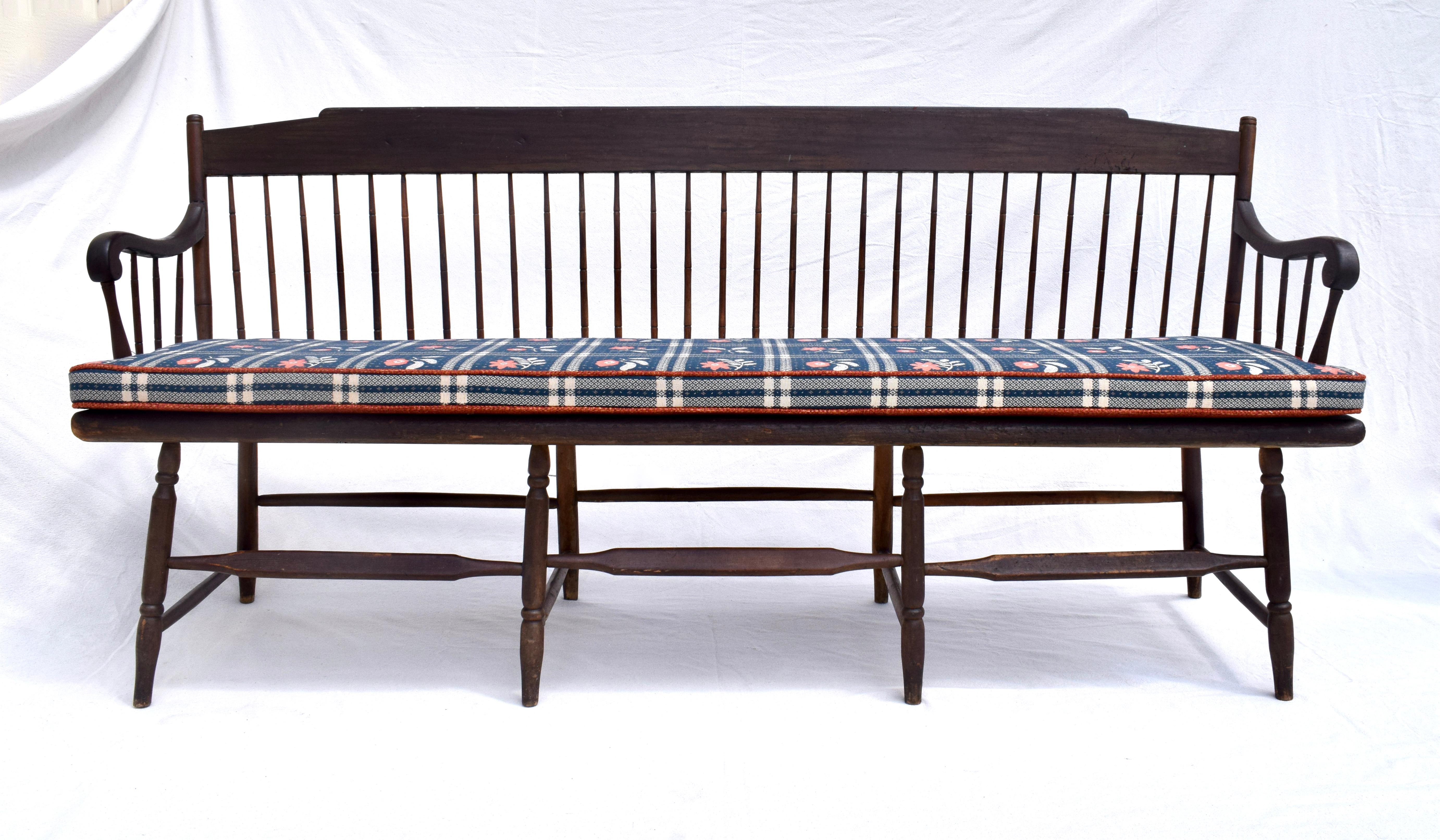 Early 19th c single plank seat Windsor bench with wood spindles of bamboo turnings and mortised joinery throughout. The form is simple and has a warm natural patina. Enhanced with new custom loose cushion in woven textured Ralph Lauren vintage stock