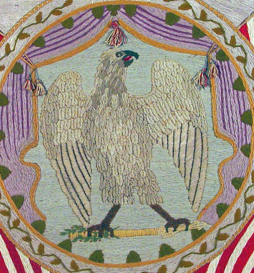 American Woolwork Picture (woolie) of The American Eagle surrounded by Thirty-two Star American flags, 
Circa 1860s.

In the 19th century, there were various types of woolworks: those made for private use, those made for public sale, and in