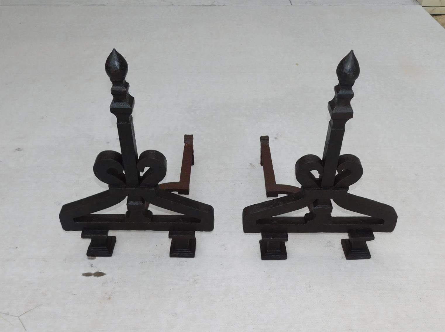 American wrought iron faceted lemon finial andirons with central squared tapered columns, flanking scrolled banded plinths, curvature dog legs, and resting on double column block feet. Early 19th Century