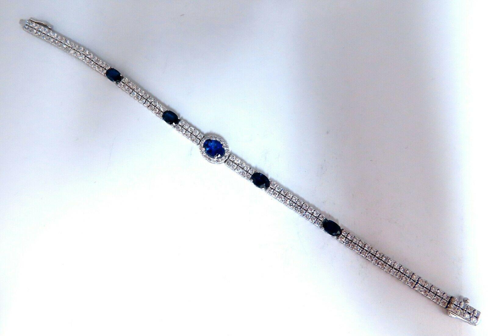 Americana Double Stranded Royal Blues.

Cluster Halo's

Natural Blue Sapphires bracelet.

1.06ct Center

2.52ct Sides

Clean Clarity & transparent.

 & 4.00ct Diamonds.

Full Round cuts, great sparkle.

Clean Clarity & Transparent.

Center Halo: 8.7