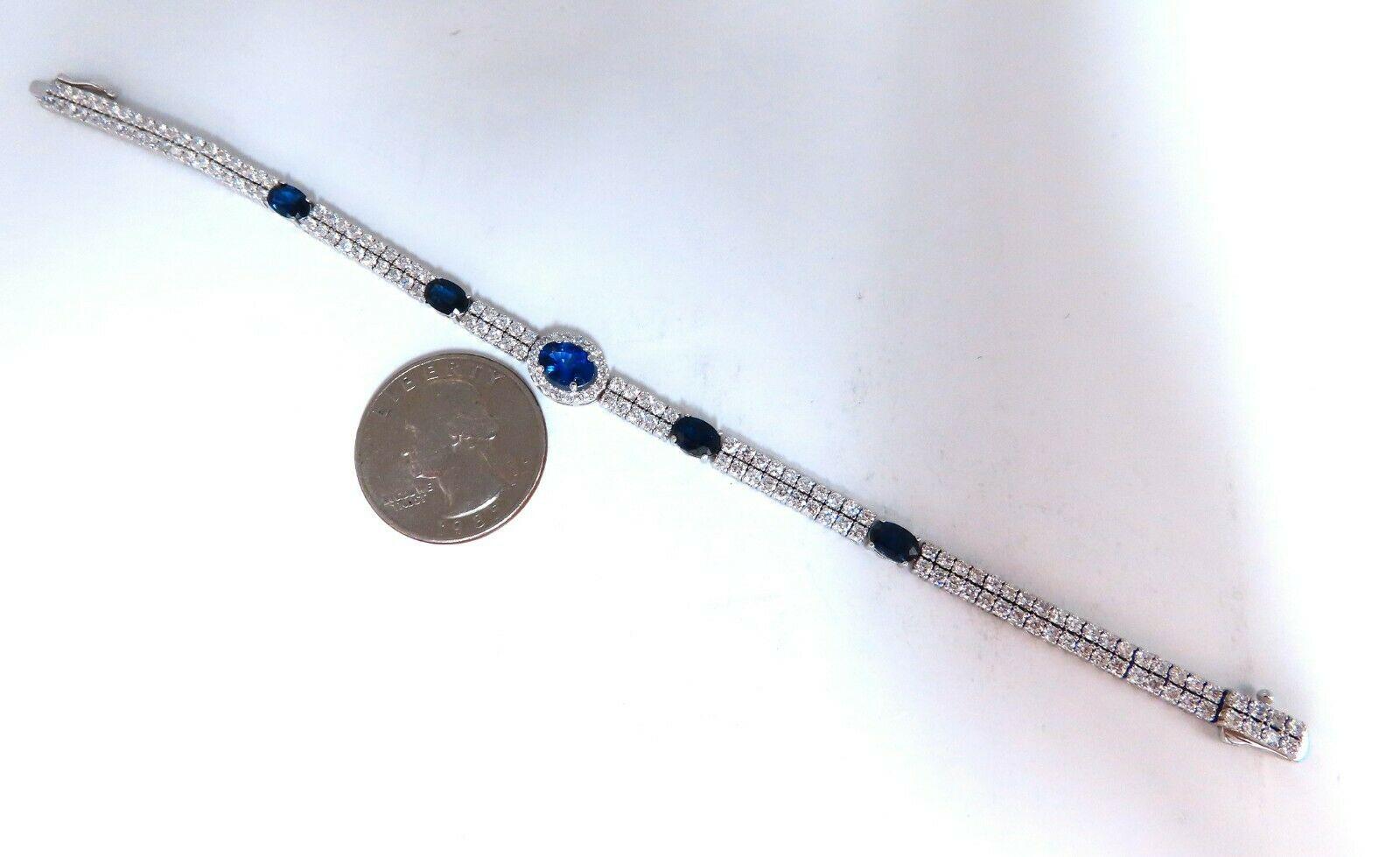 Americana Double Stranded Royal Blues.

Cluster Halo's

Natural Blue Sapphires bracelet.

1.06ct Center

2.52ct Sides

Clean Clarity & transparent.

 & 4.00ct Diamonds.

Full Round cuts, great sparkle.

Clean Clarity & Transparent.

Center Halo: 8.7