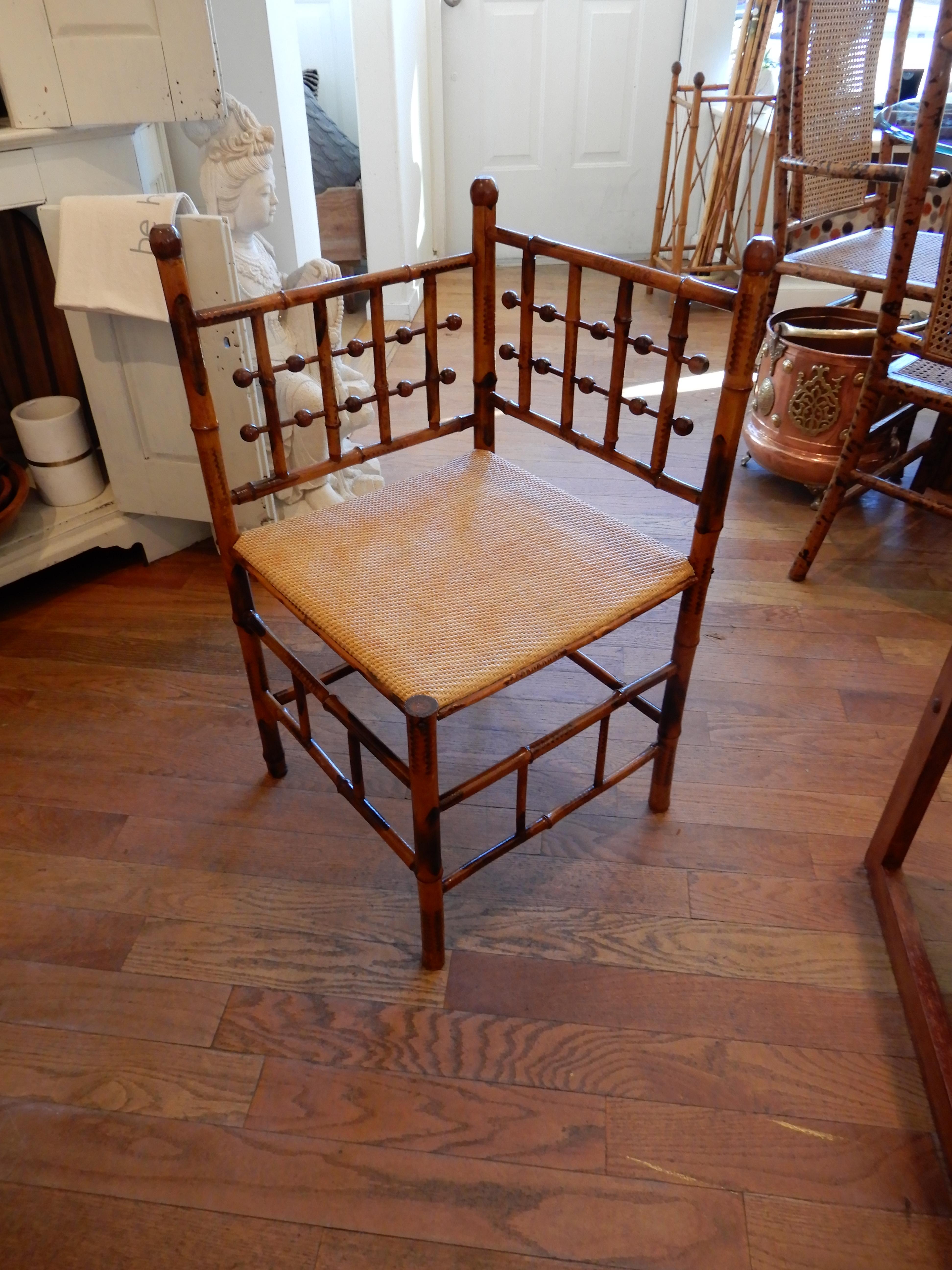 A lovely antique Americana stick and ball corner chair with a new woven mat seat, circa 1890s.
Torched bamboo finish.