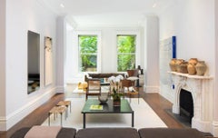 Americano woven cane and blackened steel ottoman stool