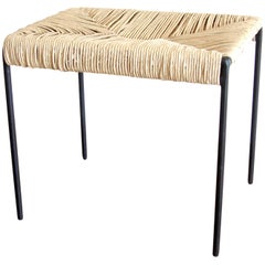 Americano woven cane and blackened steel ottoman stool