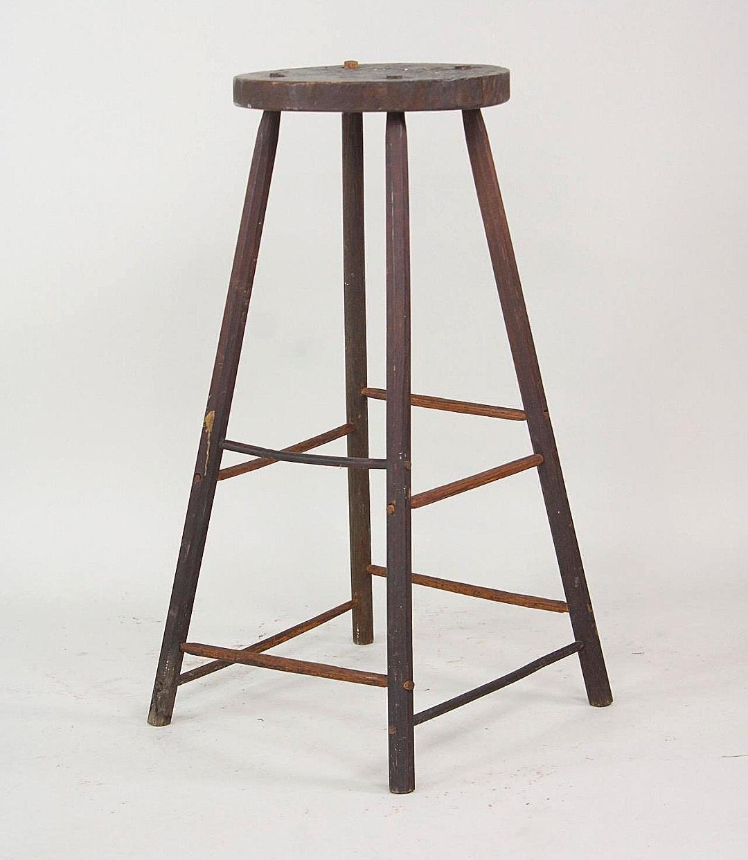 A wonderful stool in the Windsor taste. Originally created in the 1830s. At some point one of the legs was replaced with what appears to be a very old broom handle. Lots of flair, lots of style, perfect as a pedestal for displaying your folk art