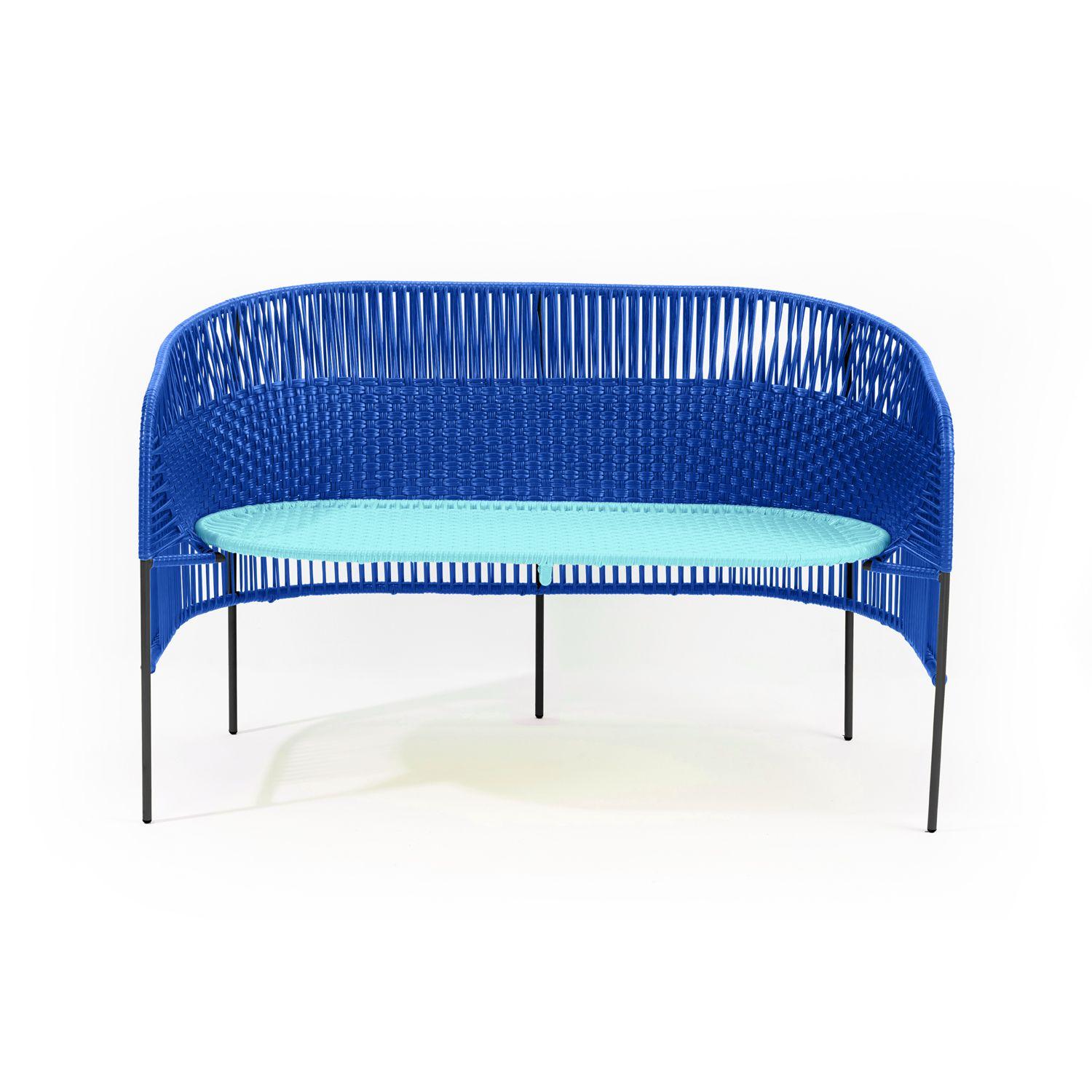 The elegant Caribe 2 Seater Bench is a colourful design for seating arrangements inside and outdoors. It’s part of the Caribe collection, designed by Sebastian Herkner for ames. The German designer visited Colombia together with ames founder Ana