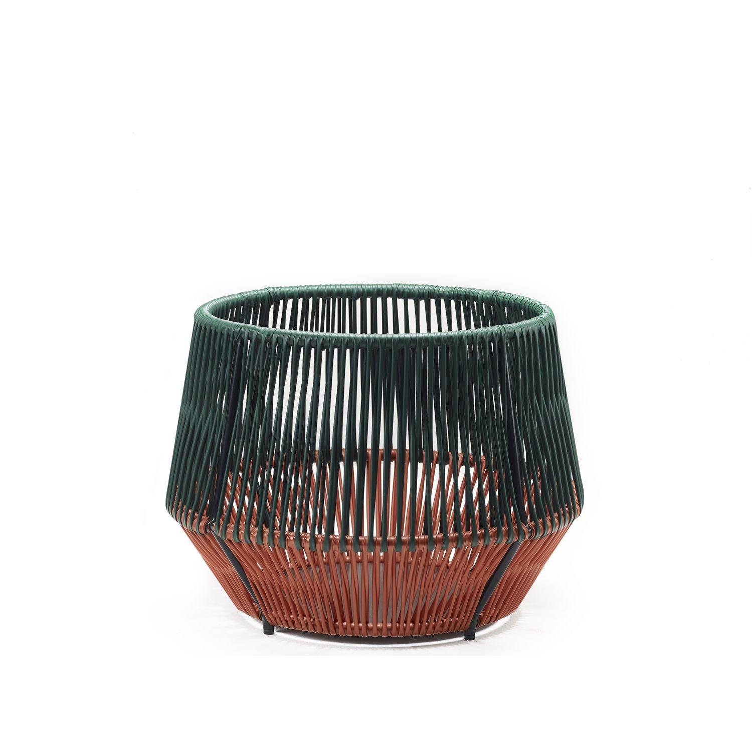 Material
Galvanized and powder coated tubular steel. PVC strings made from recycled plastic.
COLOR: moss green/ copper/ black
h 374 x Ø 440 mm

The Caribe Chic Basket is an elegant design by Sebastian Herkner and can be used indoors and outdoors as