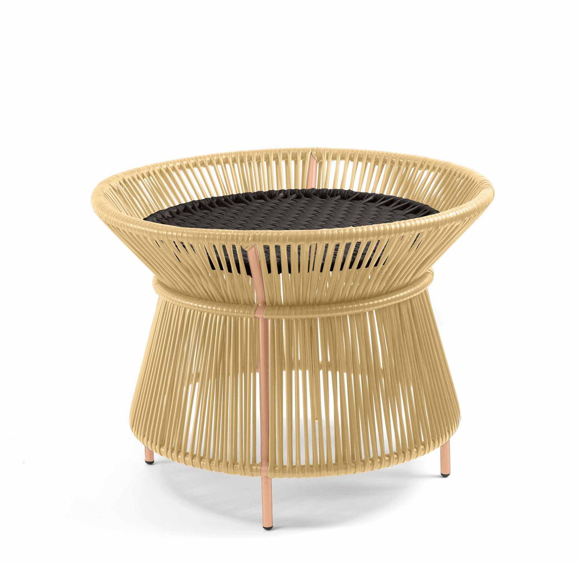 The Caribe Chic Basket Table is an elegant design by Sebastian Herkner and can be used inside and outdoors. It’s part of our Caribe Chic collection, featuring an intricate hand-woven webbing in contrasting earthy, muted shades. The pieces and
