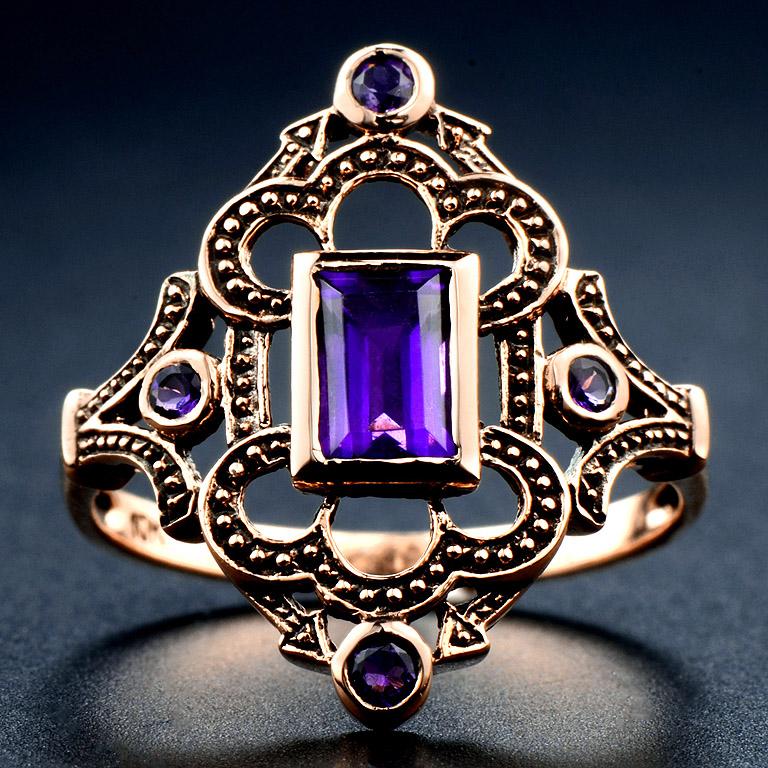 Victorian Style Ring set with Step Cut Amethyst 0.56 Carat in the center. And 4 pcs. Amethyst 0.11 Carat. 

This Ring was made in 10K Rose Gold size US#7
