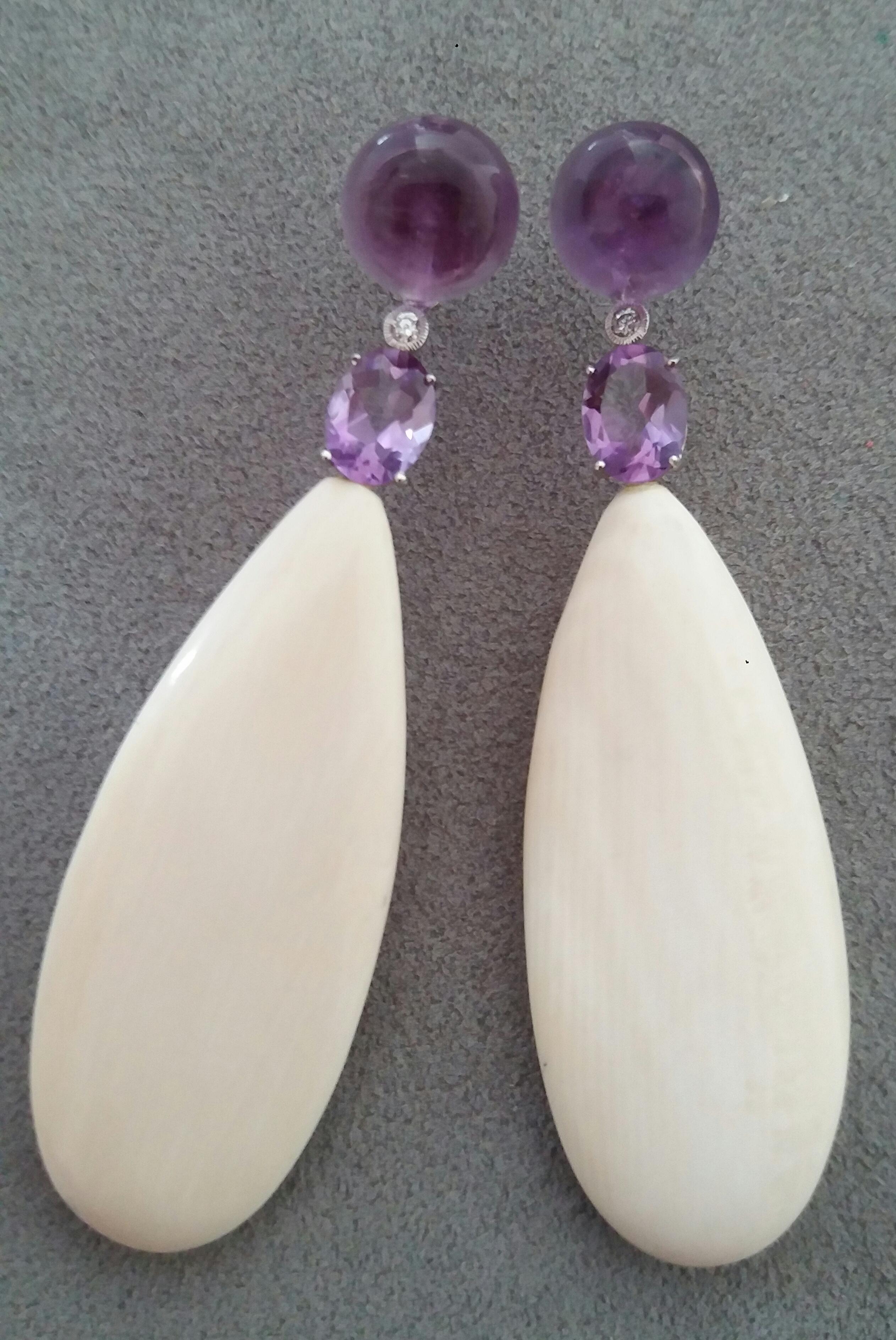 Tops are 2 round  Amethyst buttons,then 2 full cut round diamonds and 2 oval faceted Amethysts set with White Gold are holding 2 big flat Fossil Mammouth plain drops.

In 1978 our workshop started in Italy to make simple-chic Art Deco style