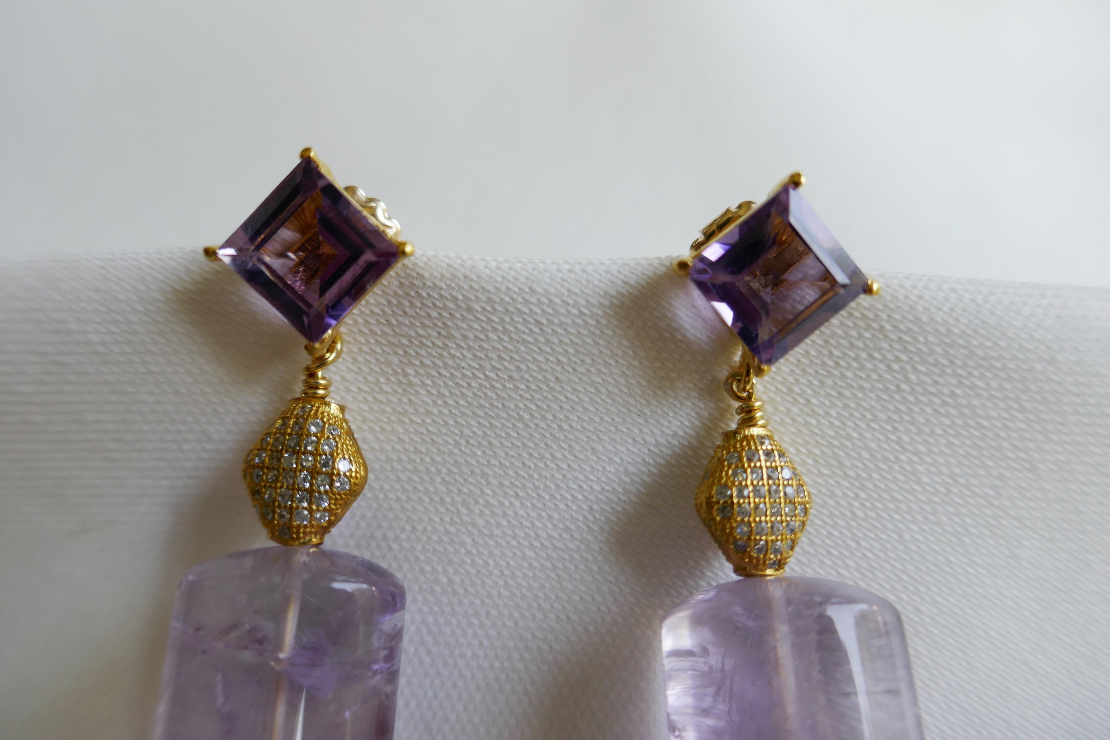 These amethyst earrings are stunning. The earrings post are 10mm x 10mm amethyst on 14k plated 925 sterling silver, vermeil 925 Cubic zirconia bead and amethyst. The large back are gold filled. The earrings are 1 7/8 inches long.  Designed and