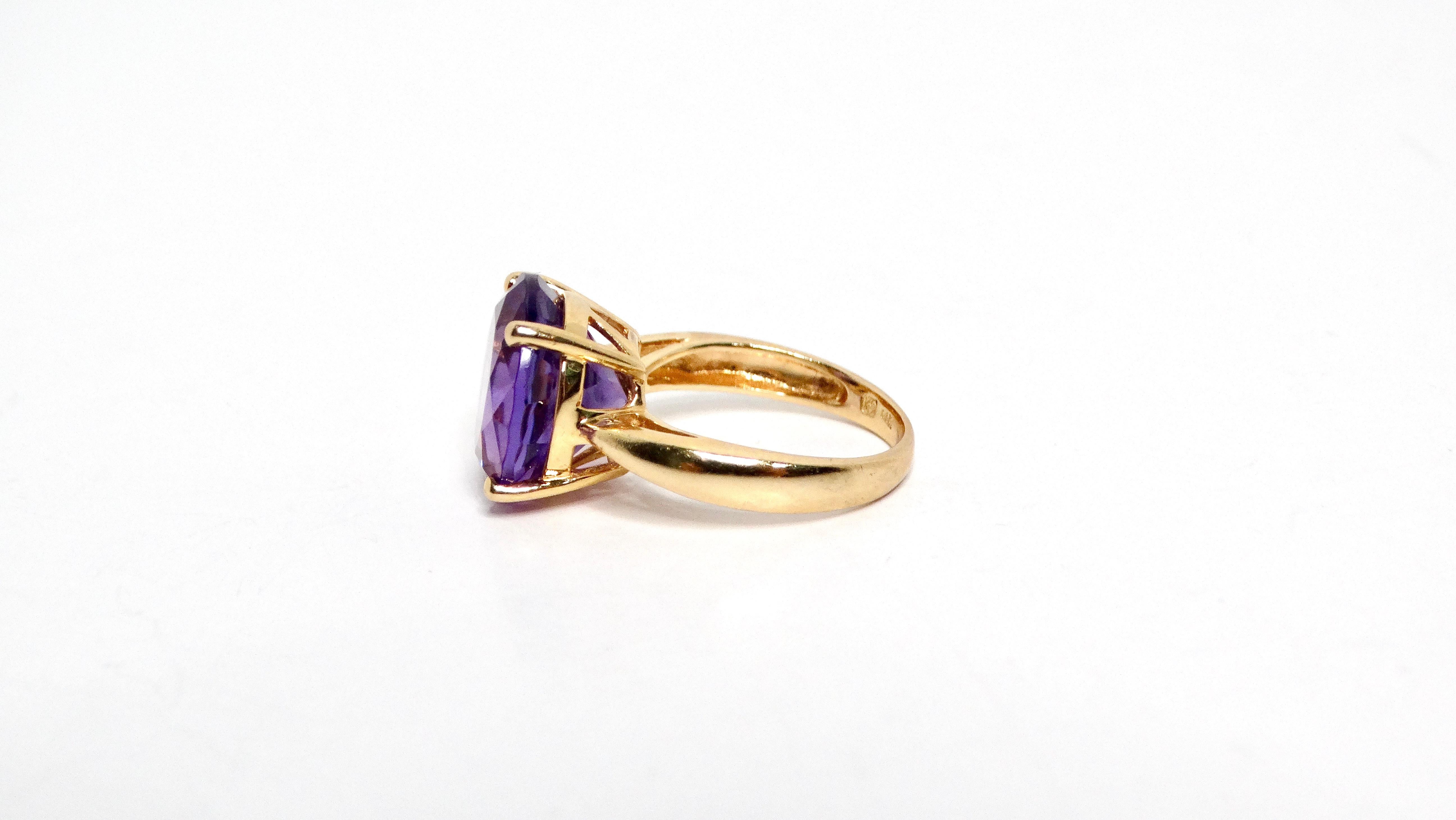 Embrace timeless elegance with the Amethyst 14k Yellow Gold Solitaire Ring, a stunning piece that radiates sophistication. This exquisite ring features a captivating amethyst stone, prominently set on a delicate thin band that beautifully