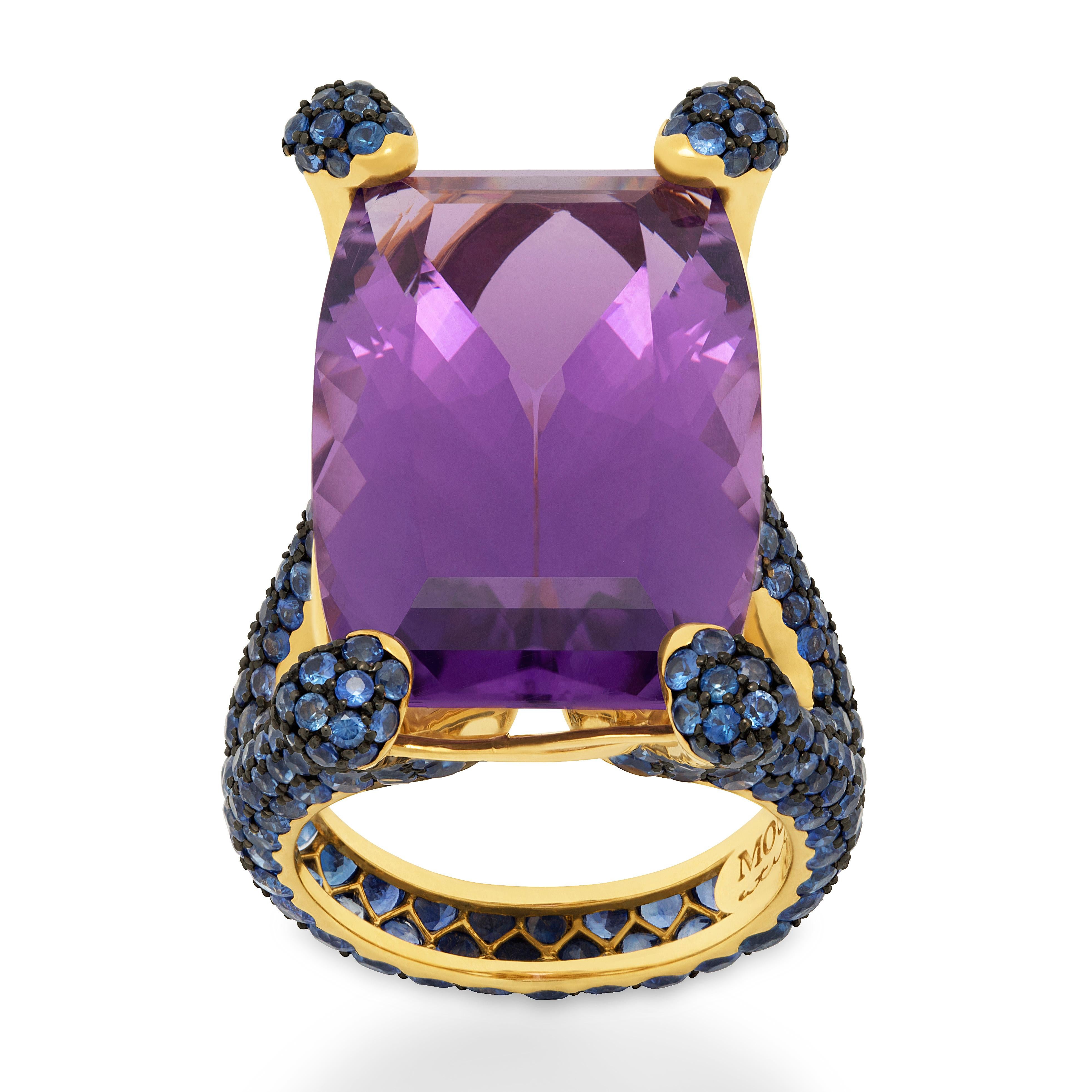 Amethyst 22.06 Carat Blue Sapphires 18 Karat Yellow Gold Ring
Highlighting a 22.06 Carat Amethyst and 358 Blue Sapphires weighing 6.52 Carats are mounted on an 18 Karat Gold lined with black rhodium. It displays a riveting interplay of contrast