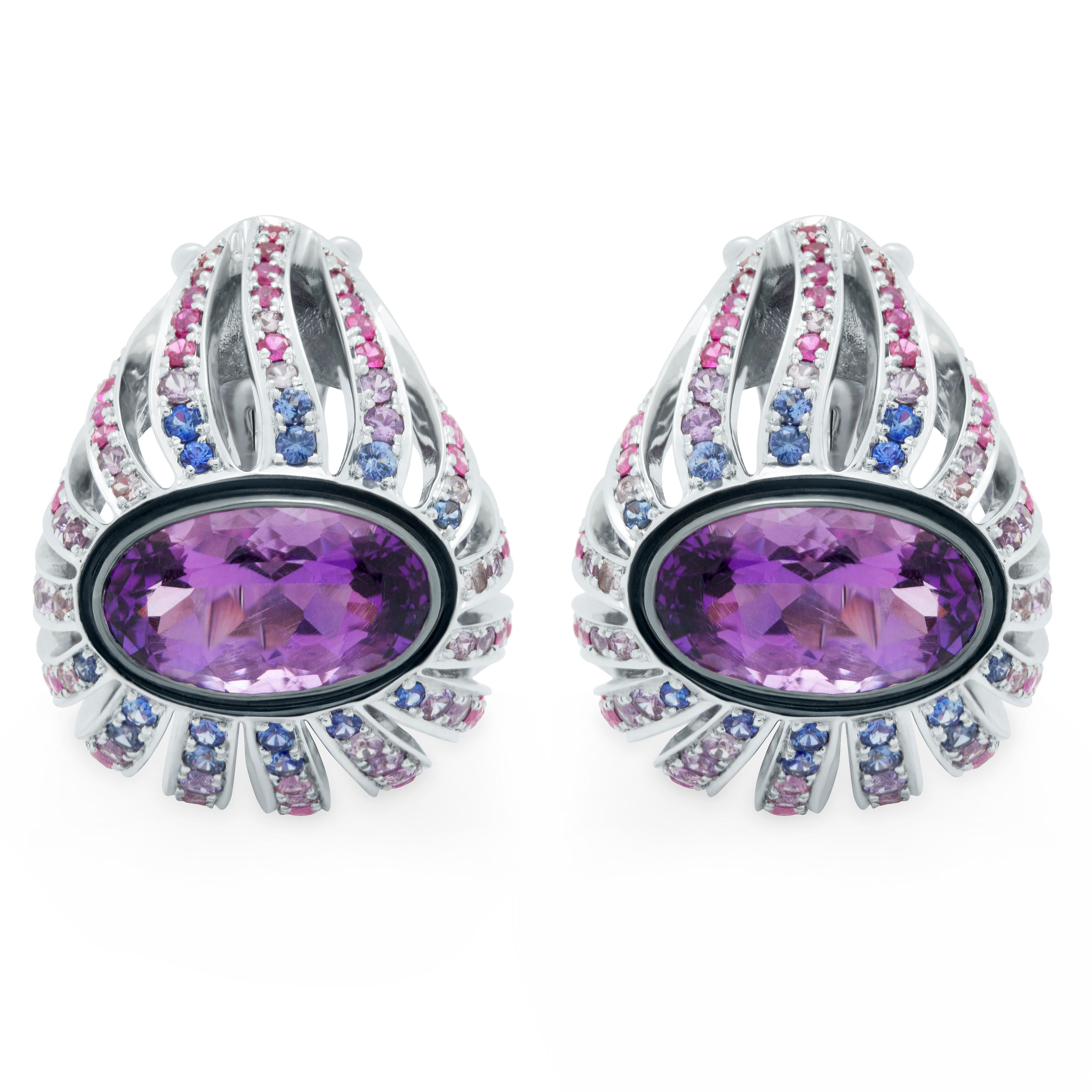 Amethyst 4.07 Carat Rubies Sapphires 18 Karat White Gold New Age Earrings
An incredibly bright two Oval-shape 4.07 Carat Amethysts, from which many 18 Karat White Gold paths slide down, where Pink, Blue and Purple Sapphires weighing total 1.44 Carat