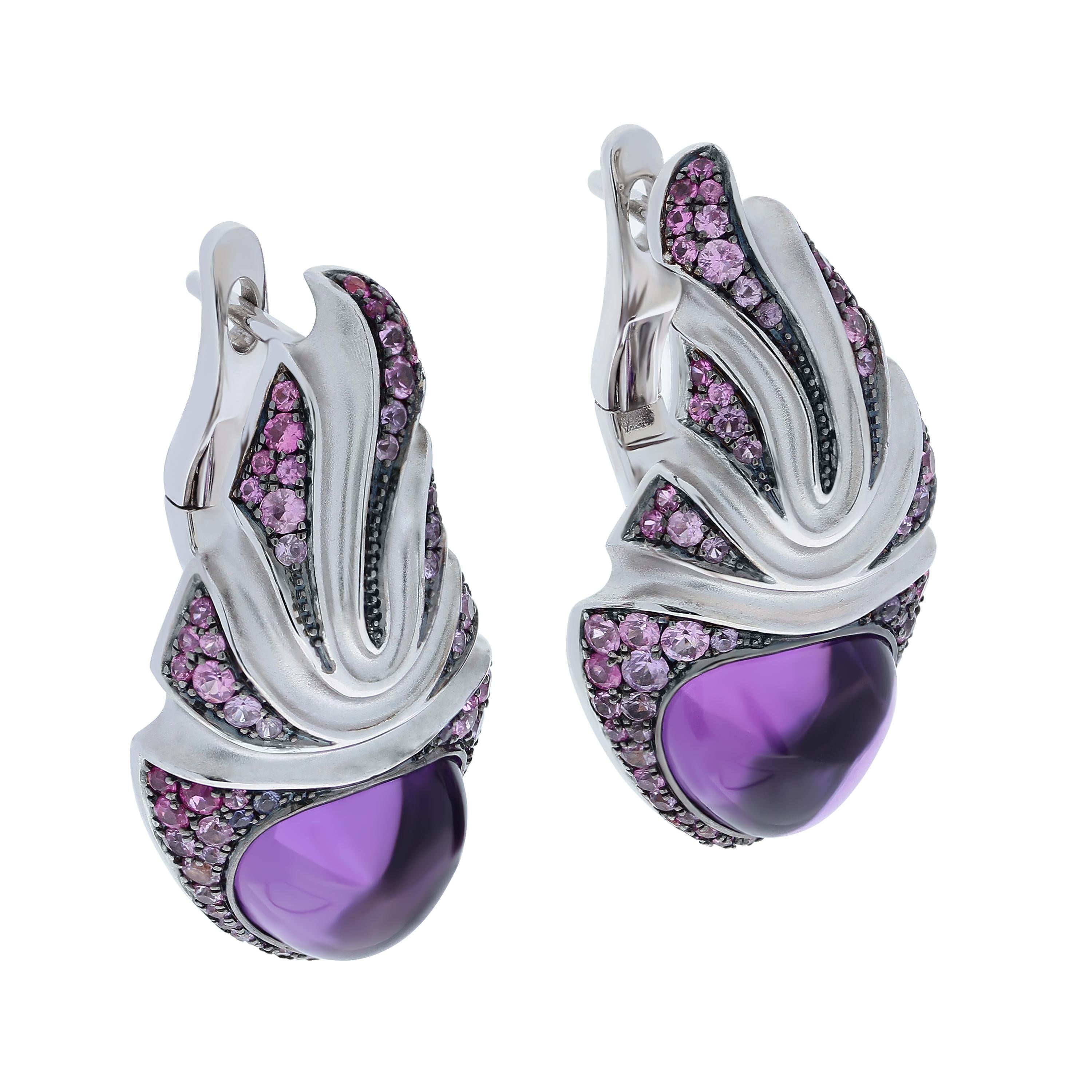 Amethyst 7.83 Carat Sapphire 18 Karat White Gold Earrings
As always, Mousson Atelier is playing with forms. Look at this incredibly stylish Earrings. It seems that 18 K White Gold literally flows like dough to the central stones, 7.83 Carat