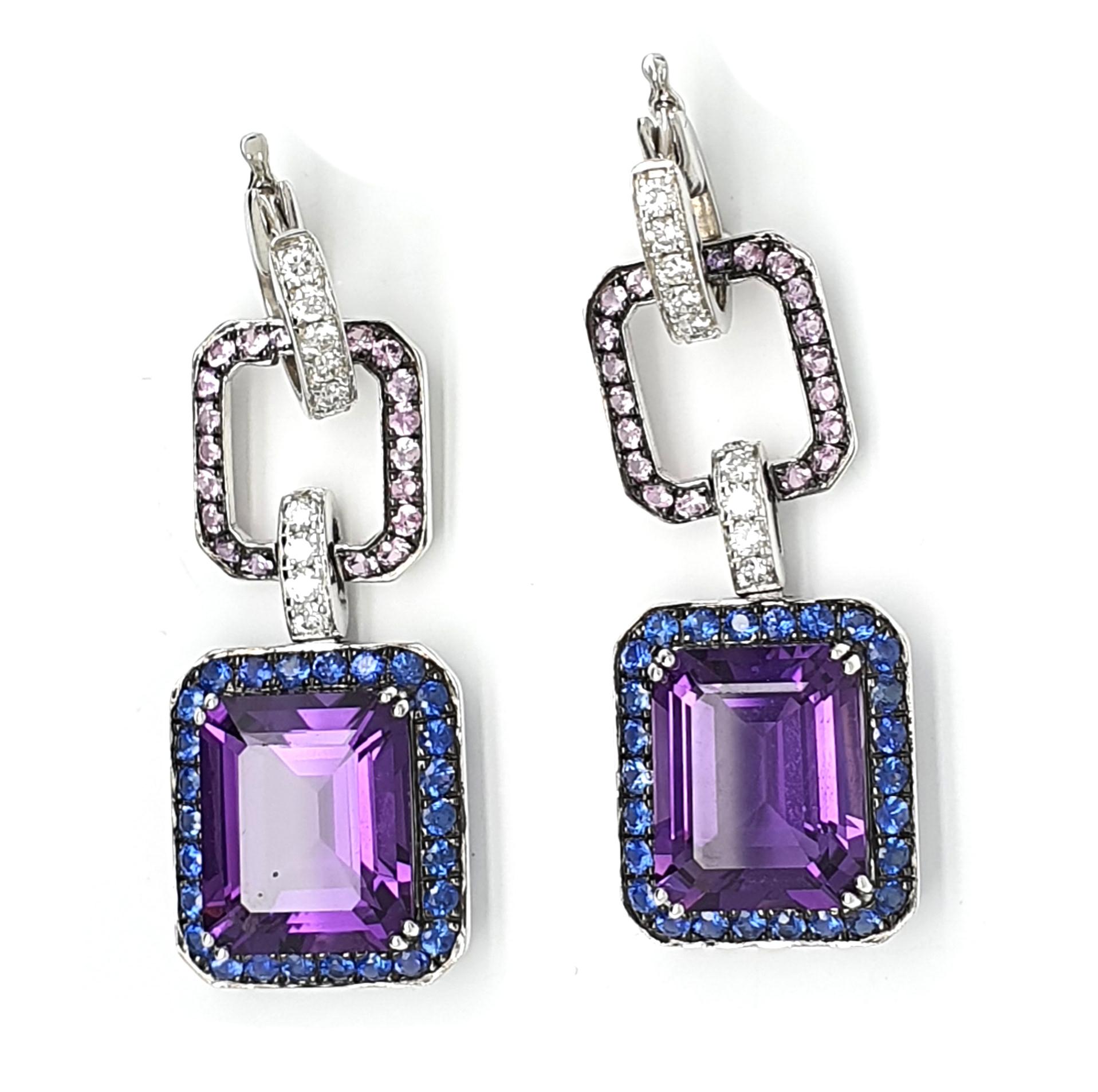 A pair of 18Krt white gold earrings (pendant) occupied with 9.77ct Amethyst, 8-angular sharpened with		
entourage of blue-lilac Corunds, 1.38ct, occupied with pink Corunds 0.74ct and brilliant cut	
diamonds 0.53ct W/VVSi	