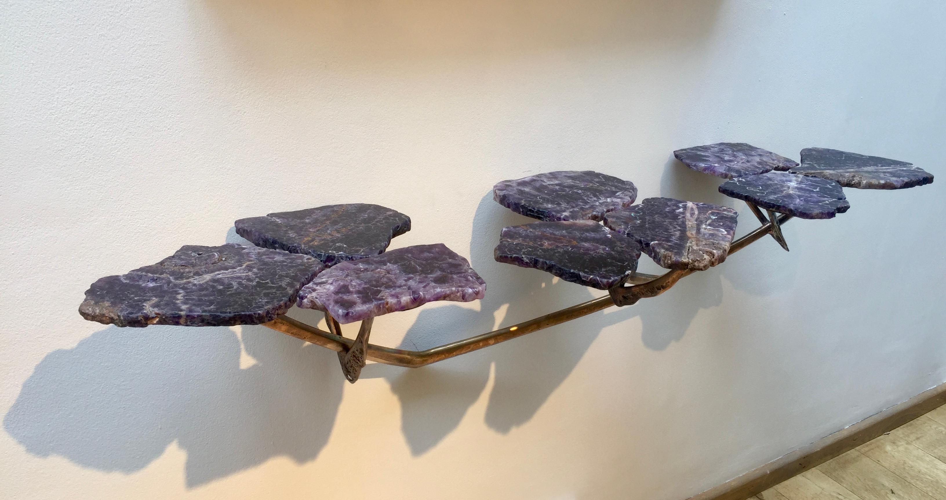 Unique piece.
Cut amethyst sections on a hand-forged bronze base, formed as stylised 'petals' supported on angular bronze 'stems'.