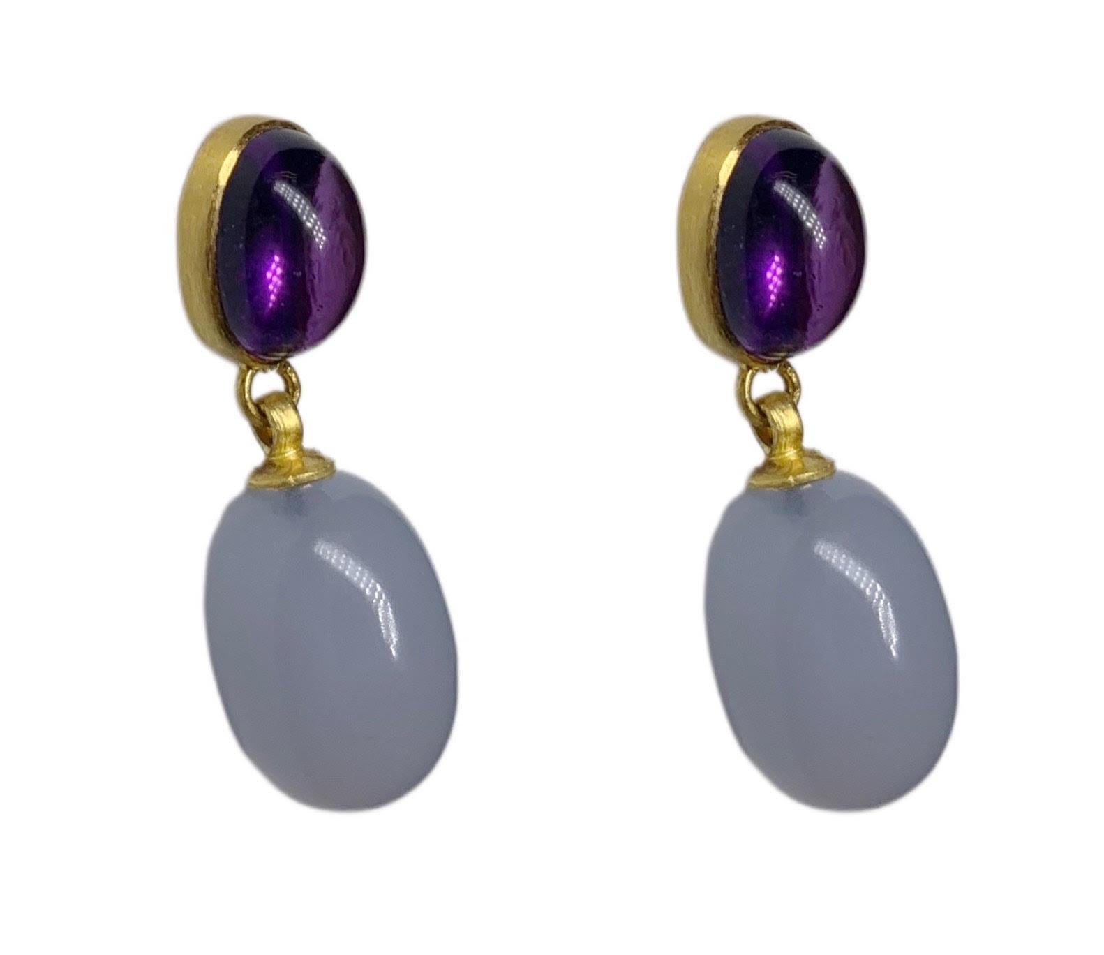 These stunning 6.35 carat Amethyst and 20.90 carat Chalcedony dangling earrings have soft 18 Karat Yellow Gold smooth finish. 

A2 by Arunashi Amethyst and Chalcedony Dangling Earrings 
18 Karat Yellow Gold 
Amethyst weighing 6.35 carats
Chalcedony