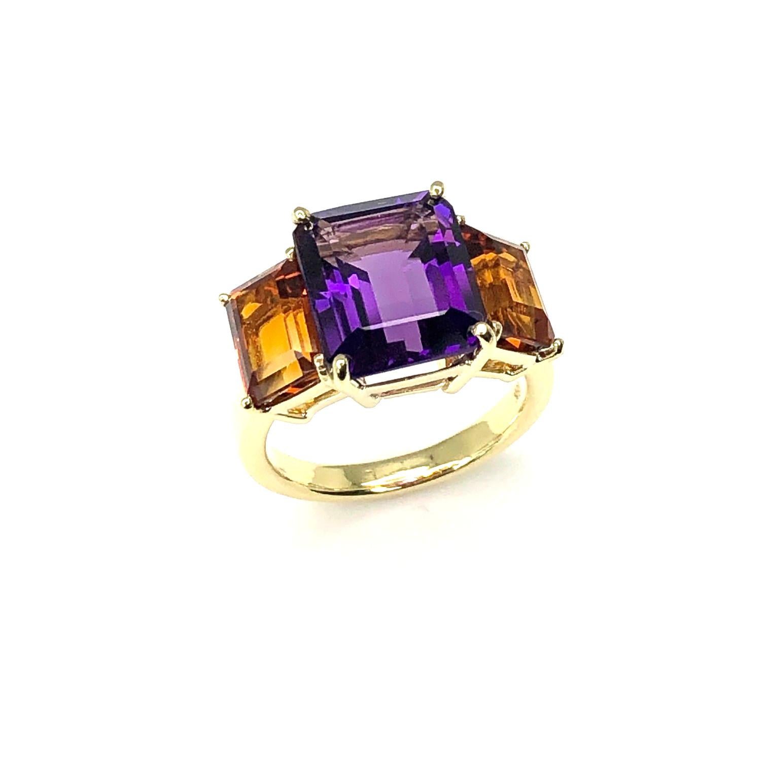 This pretty 3-stone cocktail ring features emerald-cut amethyst paired with intense citrine to show off  two beautiful colors of the same gem mineral! The amethyst is a beautiful, royal purple color and the citrine are fine 