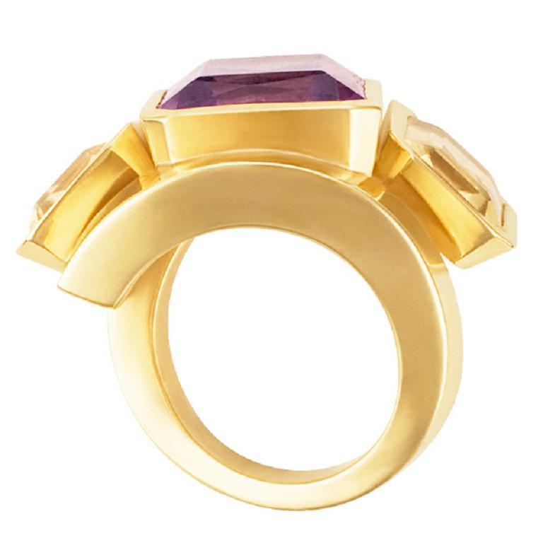 J. Roca 18k ring set with 3 rectangular semi precious stones. Create a statement with this expensive looking Amethyst center stone and two Citrine side stones.  This ring is currently size 6 and some items can be sized up or down, please ask! It