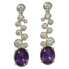 Orecchini a goccia in ametista e topazio incolore, argento e oro