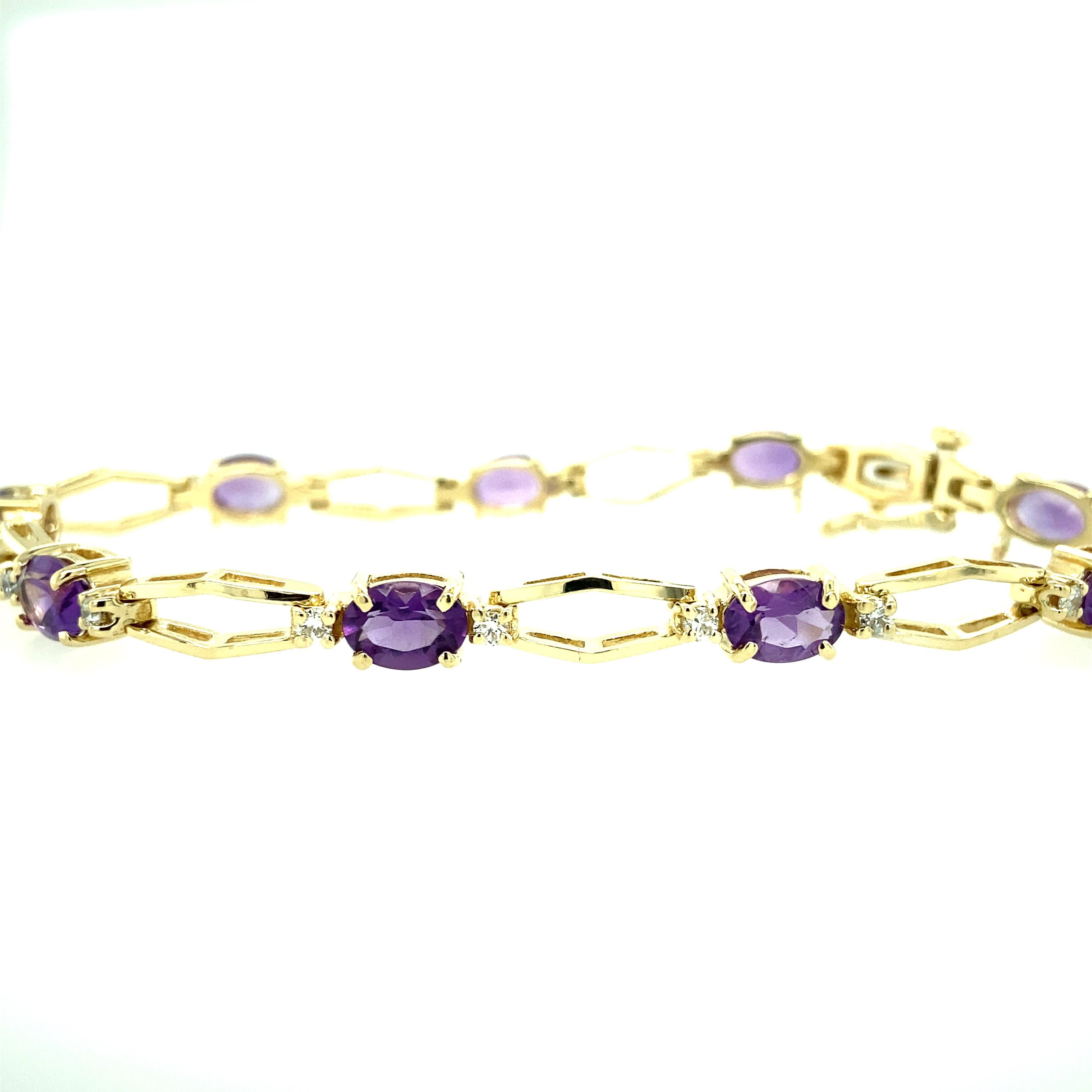 One 14 karat yellow gold (stamped 14K) estate bracelet set with nine 7x5mm oval amethysts and eighteen round brilliant diamonds, 0.50 carat total weight with matching I/J color and SI clarity.  The bracelet measures 8 inches long and is complete