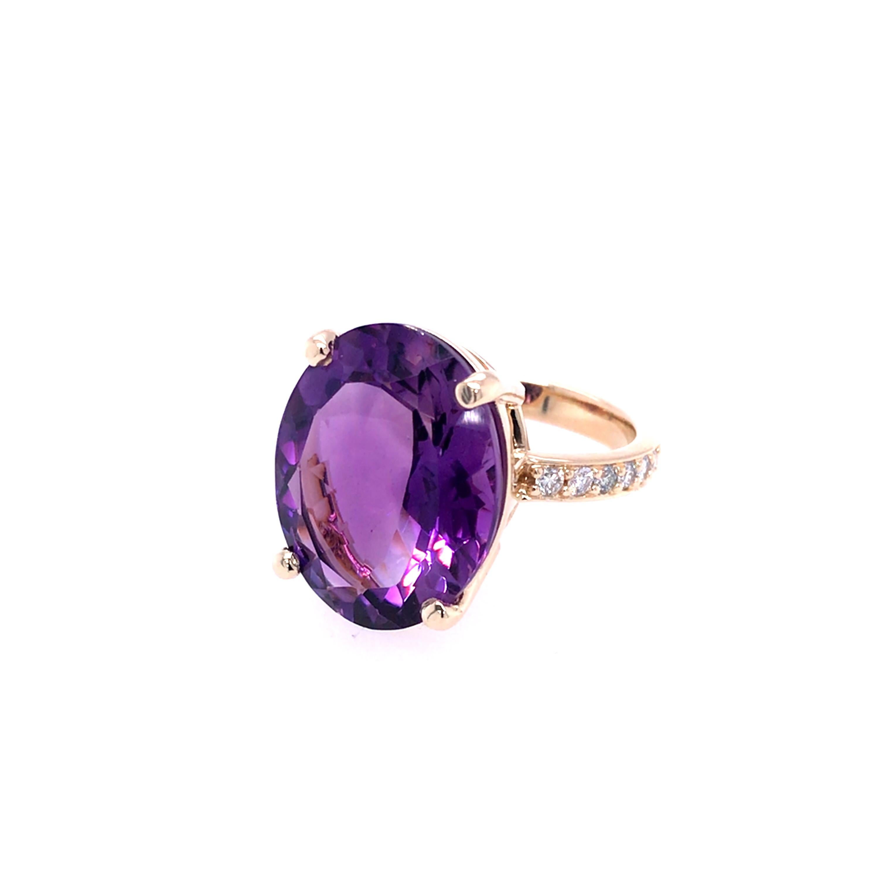 Oval amethyst and round brilliant diamond cocktail ring set in 9ct yellow gold.
One mid purple faceted oval amethyst  measuring 18mm x 14mm x 8.17mm and weighing 10.83ct
12 round brilliant diamonds weighing 0.30ct in total, GSI
Setting - 4 claw 9ct