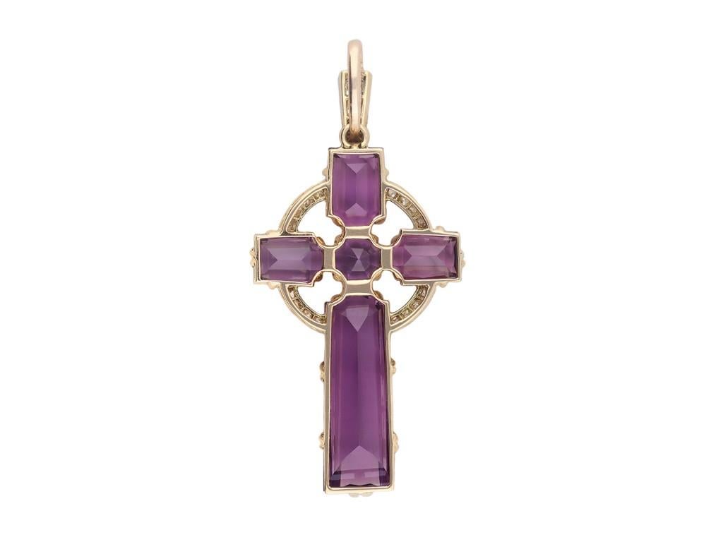 Amethyst and diamond cross pendant. Set to centre with one round old cut natural amethyst in an open back claw setting with an approximate weight of 1.10 carats, flanked by four fancy shaped step-cut natural amethysts in open back claw settings with