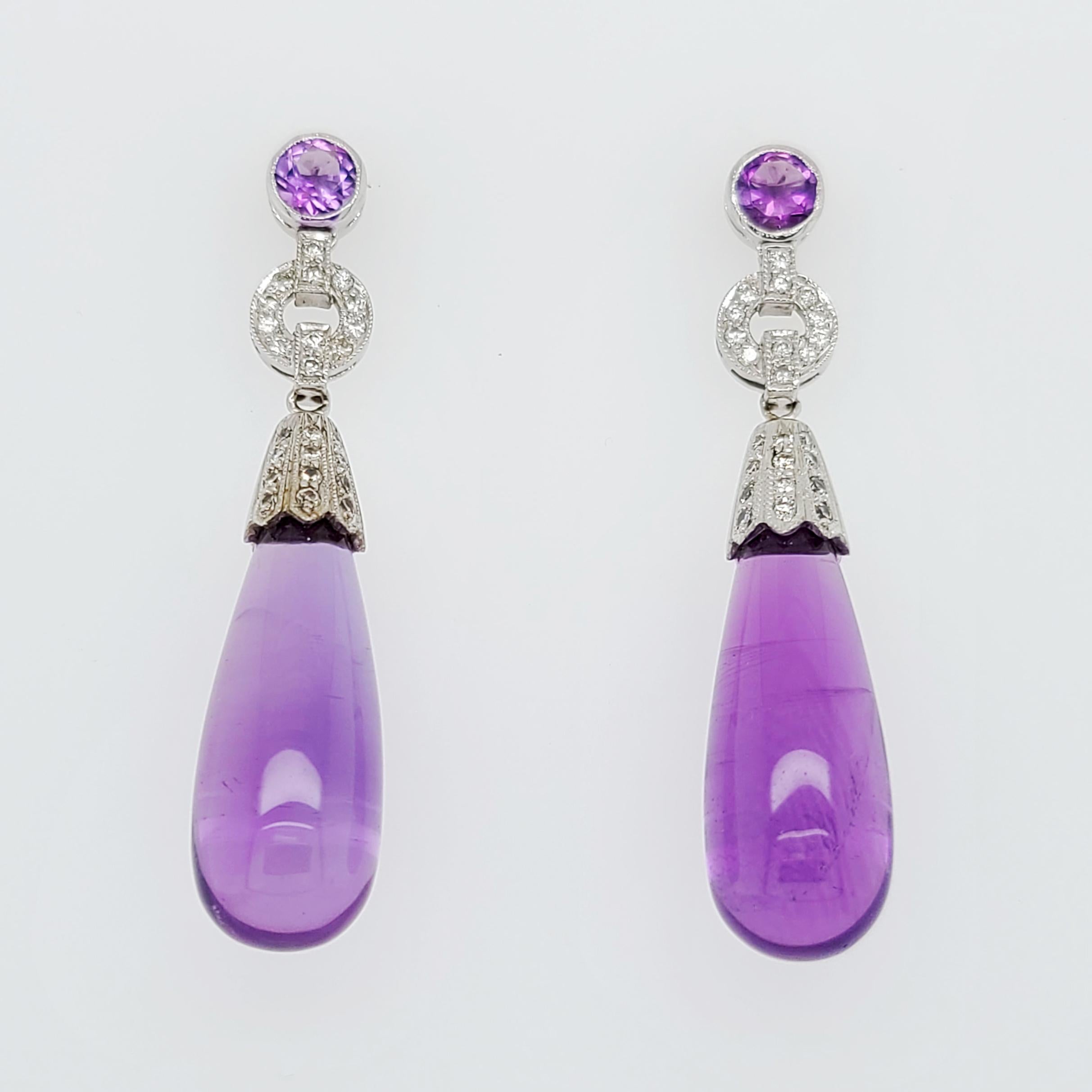 18 Karat White Gold Amethyst Drop Earrings Featuring 48 Round Brilliant Cut Diamonds Of VS Clarity and G/H Color Totaling 0.48 Carats. Pierced Post With Supportive Large Friction Backs. 1.75 Inches Long.