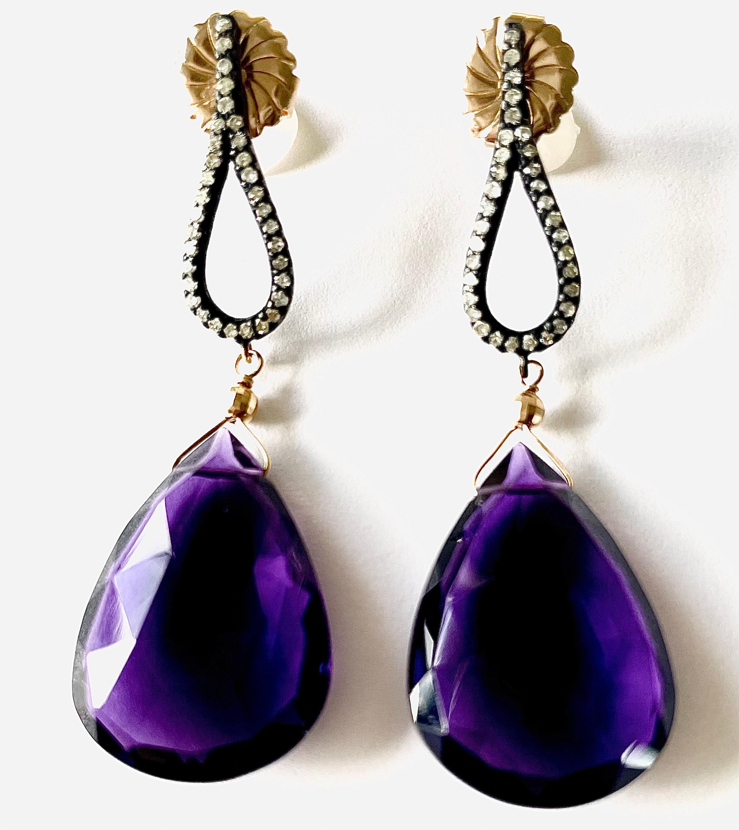 Description
Large Amethyst faceted drops 44ct, Pave diamond Black Rhodium sterling silver earrings, contrasted with yellow gold.
Item # E3067

Materials and Weight
Amethyst, 26 x 28 mm, 44 carats, drop shape.
Pave diamonds.
Posts and jumbo backs,