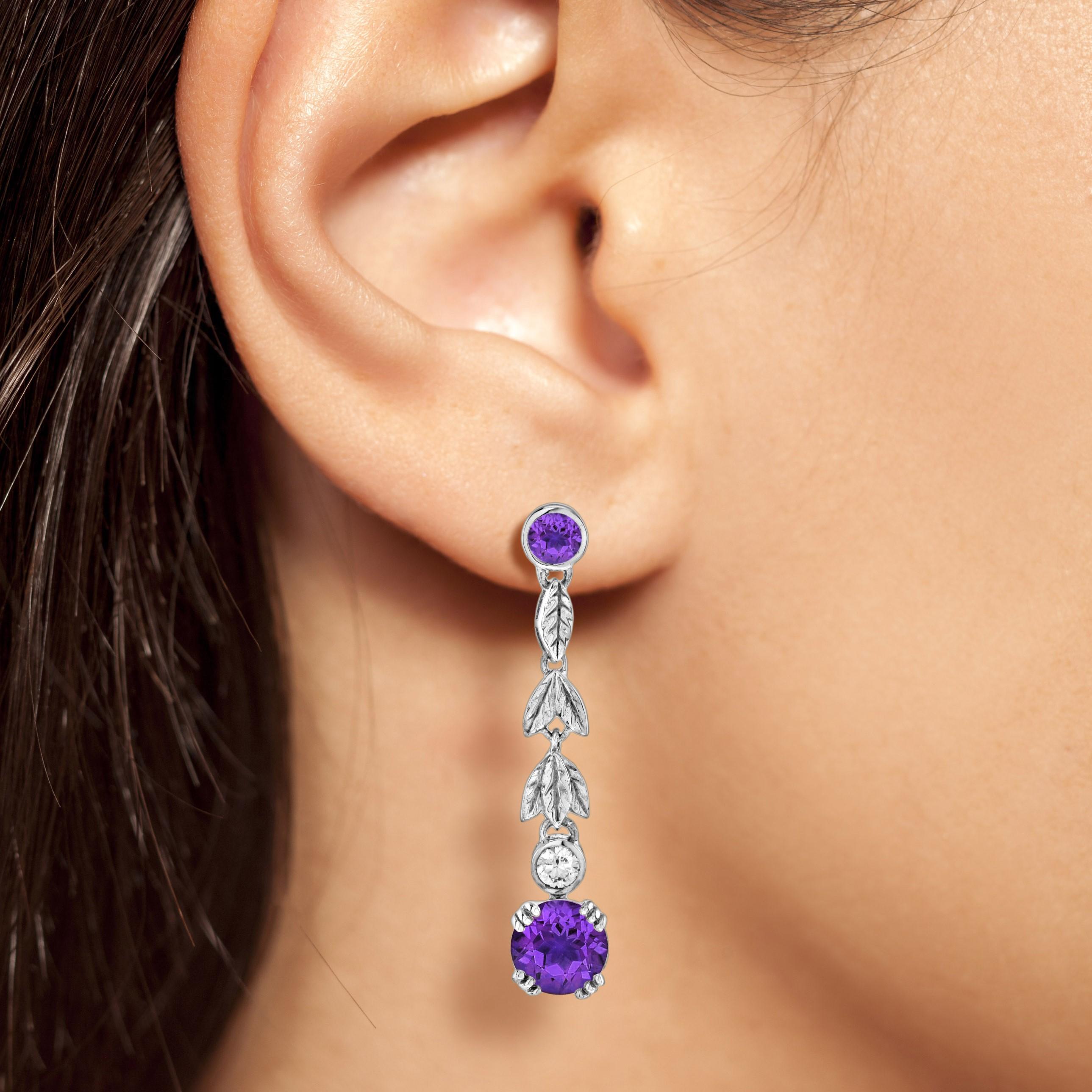 A cascading floral vines earring with a sophisticated, vintage allure. Strands of lustrous amethyst make these drop earrings the perfect finishing touch.

Information
Metal: 14K White Gold
Width: 7 mm.
Length: 35 mm.
Weight: 4.4 g. (approx. total