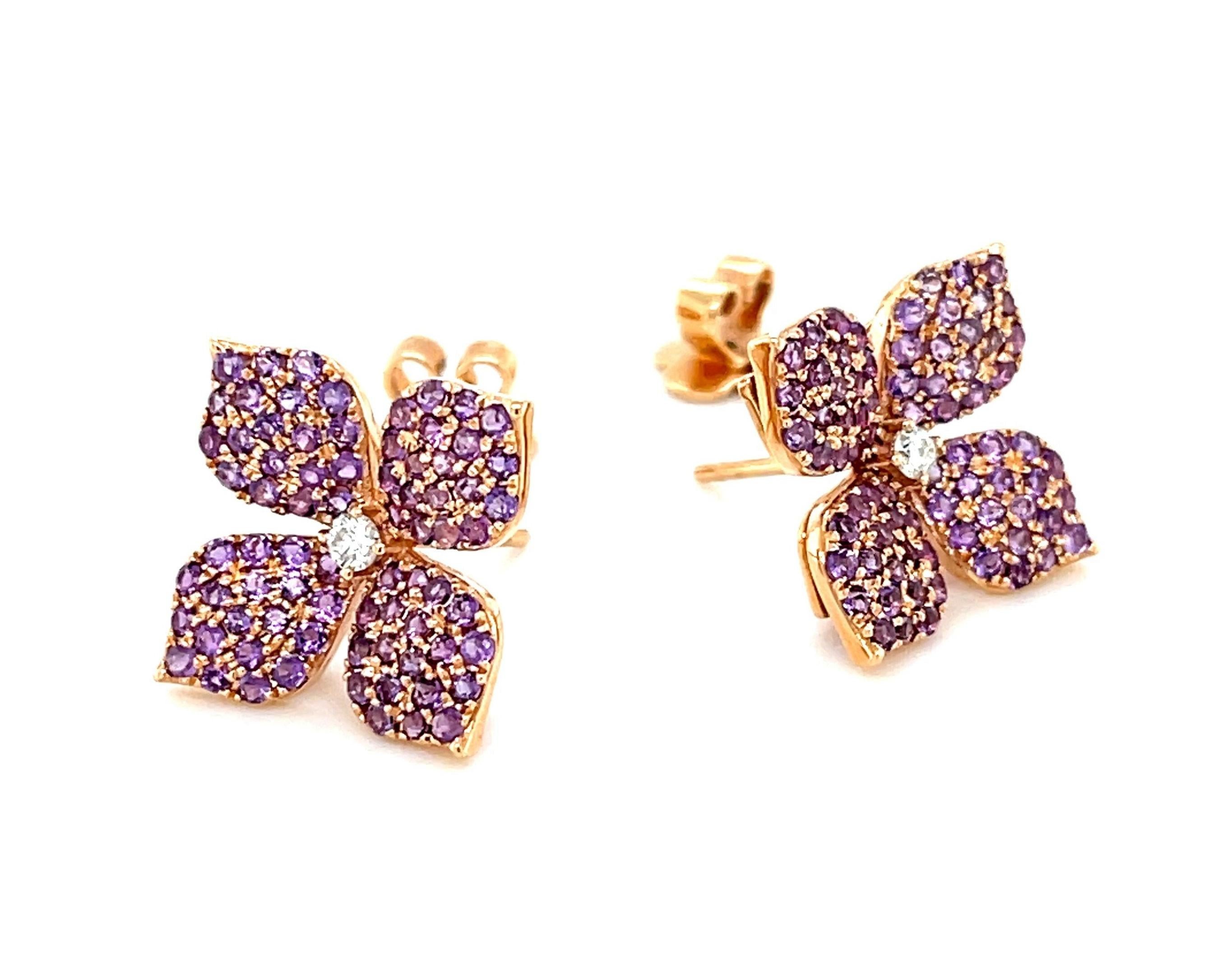 Sparkling purple amethyst petals surround brilliant white diamonds in these gorgeous floral earrings crafted of 18k rose gold. The beautifully curved petals are 