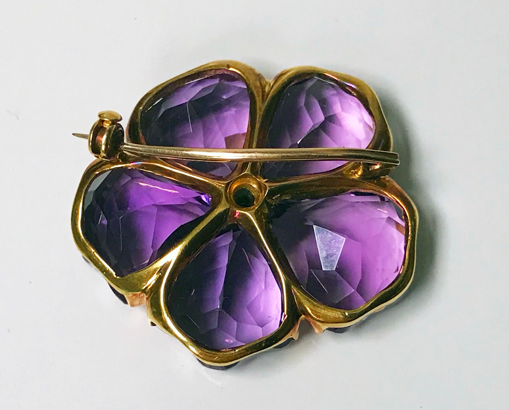 Fine Amethyst and Diamond Pansy Brooch 18K C. 1900.  The brooch of carved amethyst petals with an early european cut diamond stamen, all mounted in 18K, safety catch to pin at reverse. Diameter: 3.00 cm. Item Weight: 12.55 grams. Amethyst well
