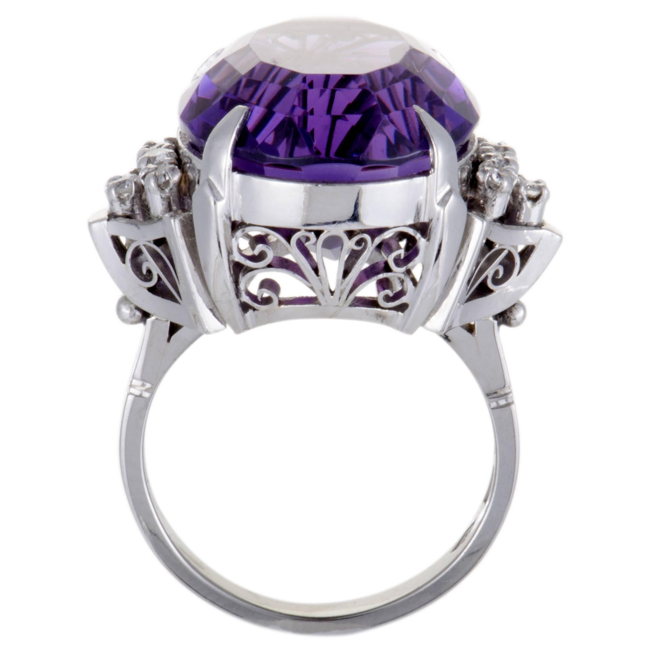 An imposing amethyst steals the limelight in this fabulous platinum cocktail ring that offers an extraordinarily eye-catching appearance. The amethyst weighs approximately 19.00 carats and it is accentuated by glistening diamond stones that amount