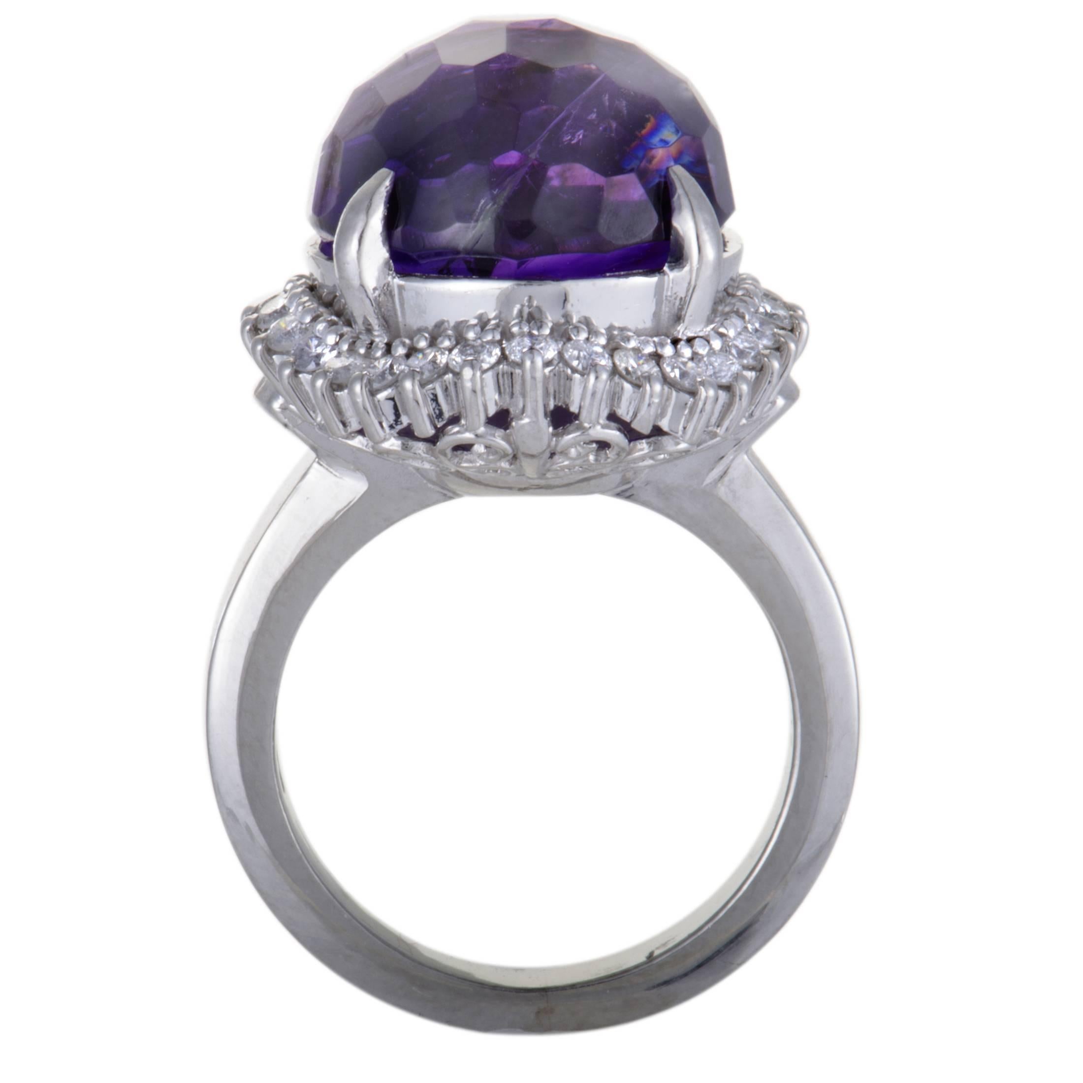 Style and elegance are embodied in this gorgeous platinum ring. The sensational ring sparkles with 0.51ct of stunning diamonds surrounding a beautiful amethyst of 13.25ct that reflects the luxurious value of the spectacular piece.
Ring Top