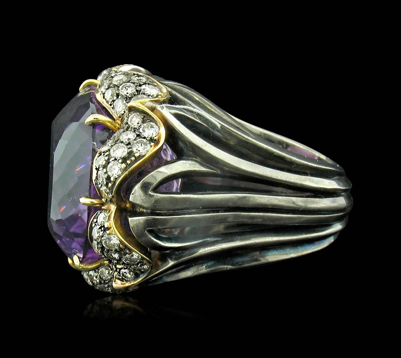 Tony Duquette Amethyst and Diamond Ring in 18K features a total Amethyst weight of 72 carats accented with Diamond pave.  Size 7 1/2.
**This ring may be resized to fit after purchase at no cost to the buyer.

Tony Duquette was a well-known painter,