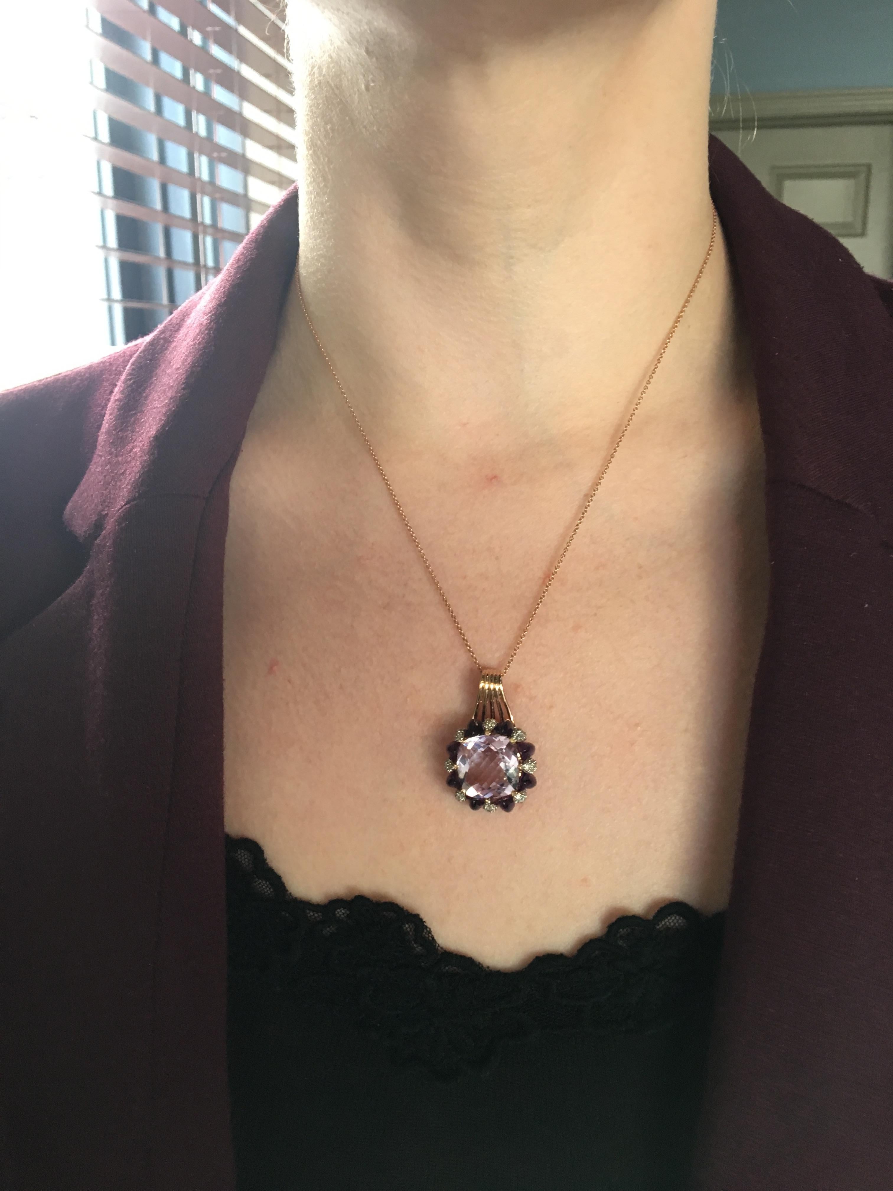 This beautiful necklace features a large checkerboard cushion shaped amethyst, surrounded by additional cabochon cut amethysts and round brilliant cut diamonds.

Designer: LeVian
Gemstone: Diamond and Amethyst
Diamond Carat Weight: Approximately