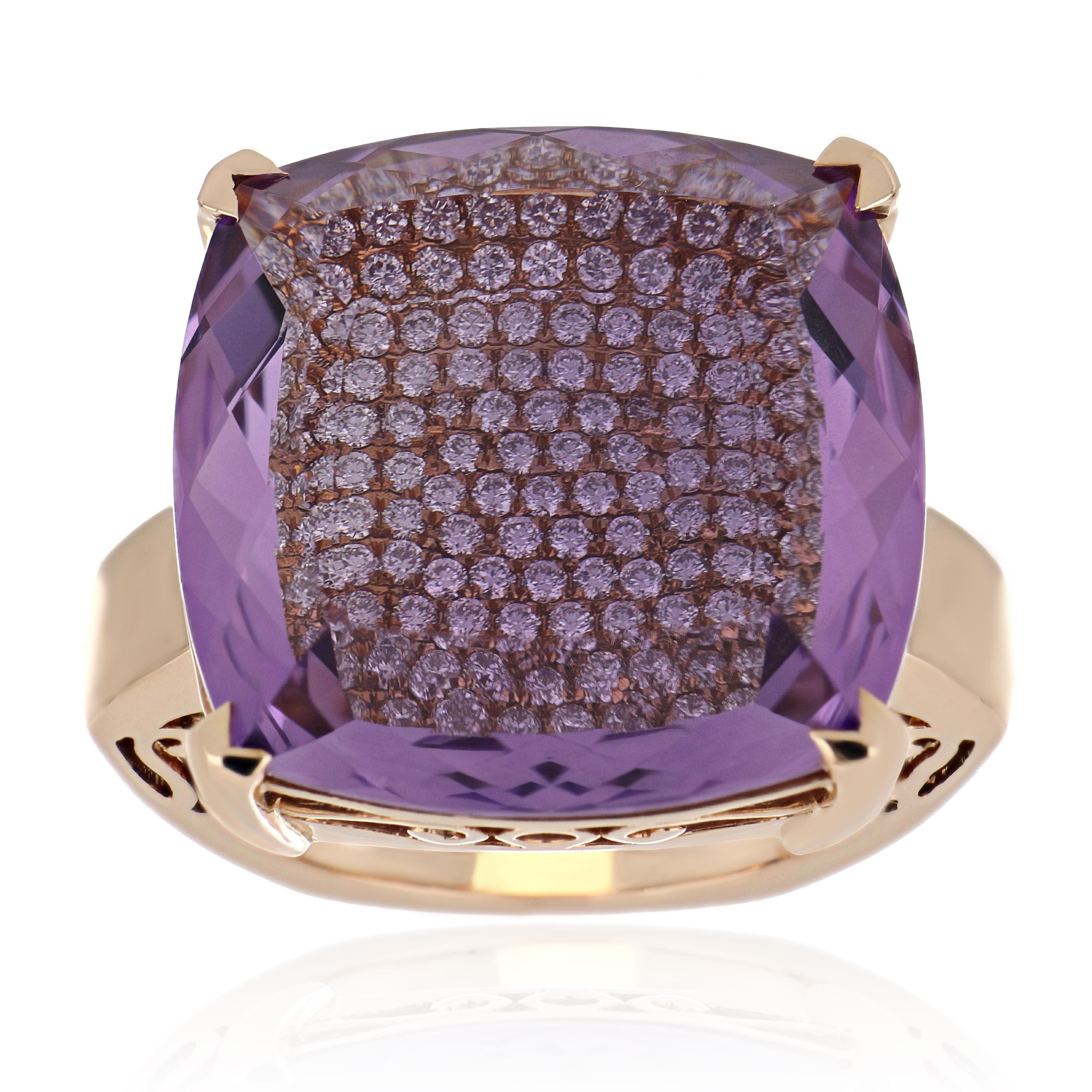 14 Karat Rose Gold ring studded with Cushion Cut  20.67 Ct  Amethyst,  with unique under stone setting of  1.06 Cts Diamond Beautifully hand crafted in 14 Karat Rose Gold.

Stone Details:
Amethyst: 20 x 20 mm

Stone Weights:
Amethyst: 20.67
