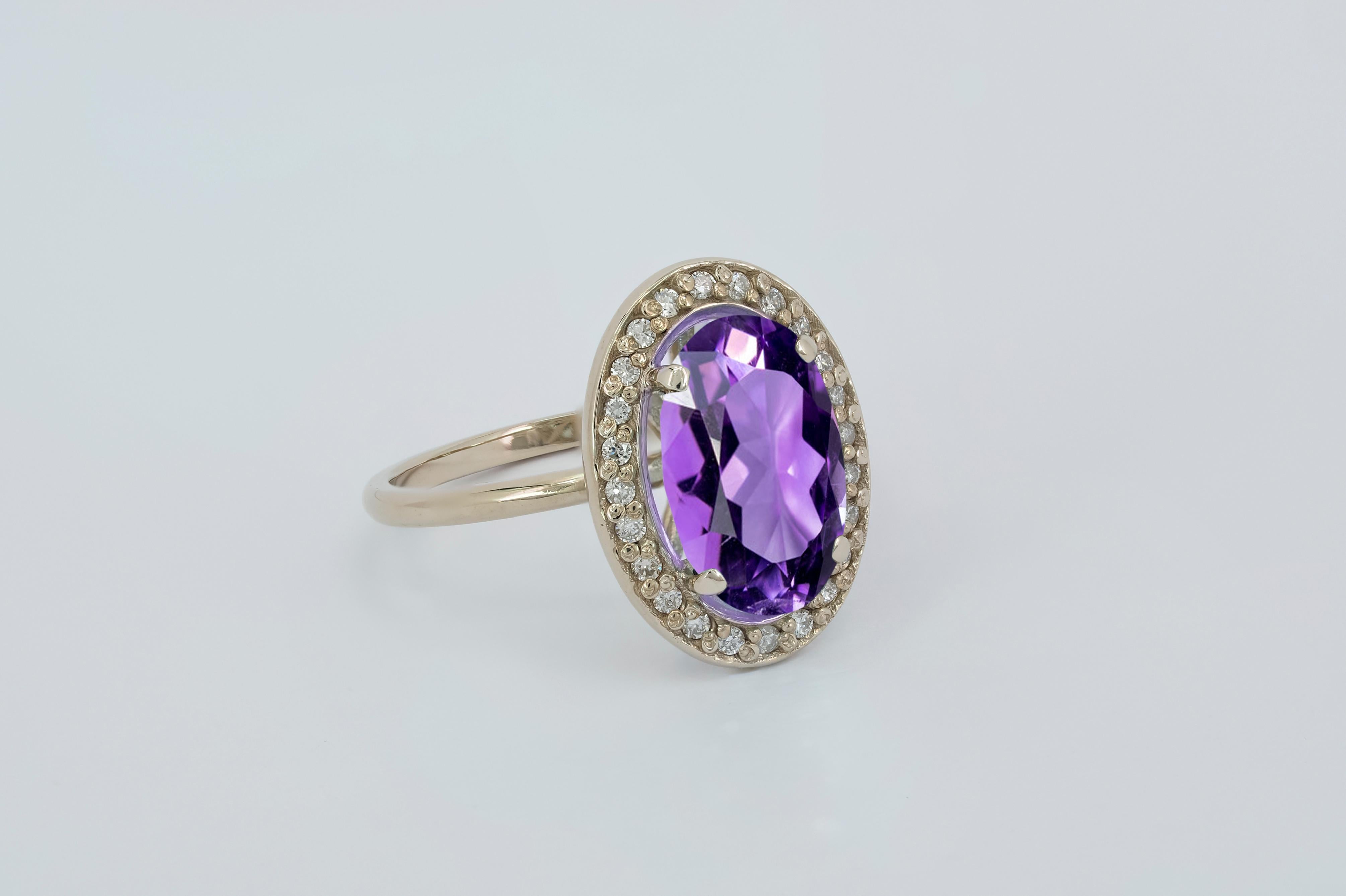 Oval Cut Amethyst and diamonds 14k gold ring.