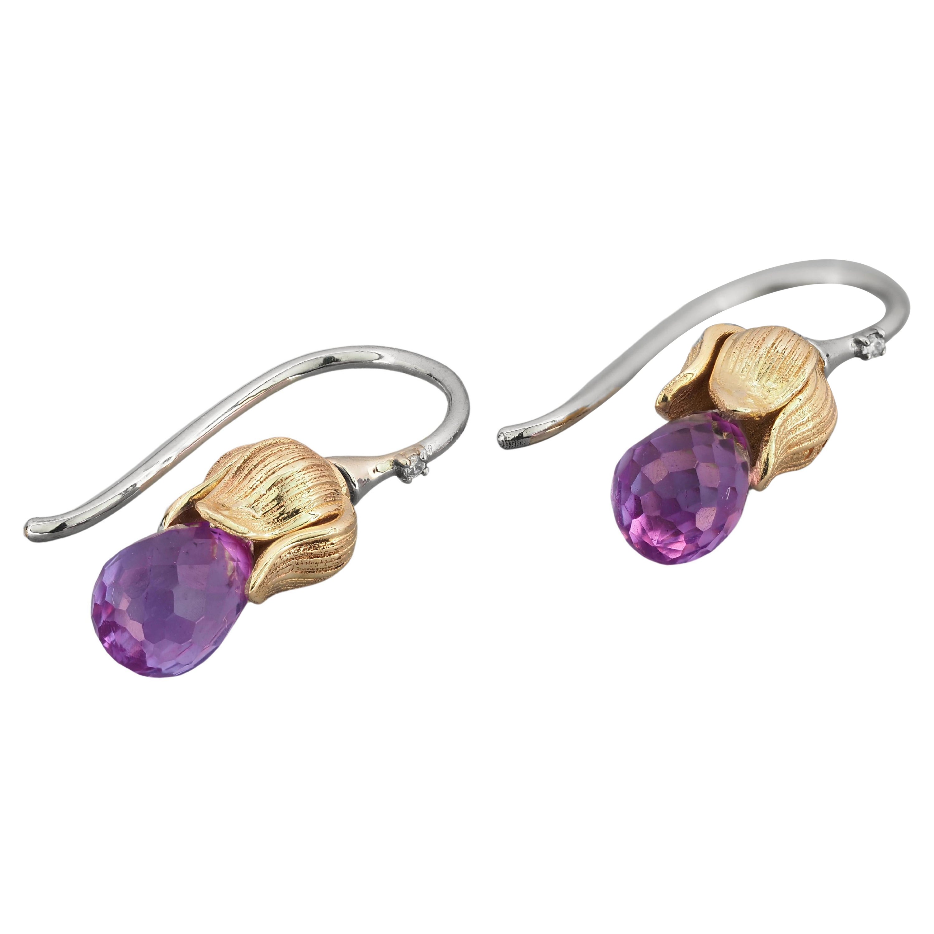 Ohrringe mit Amethysten und Diamanten.