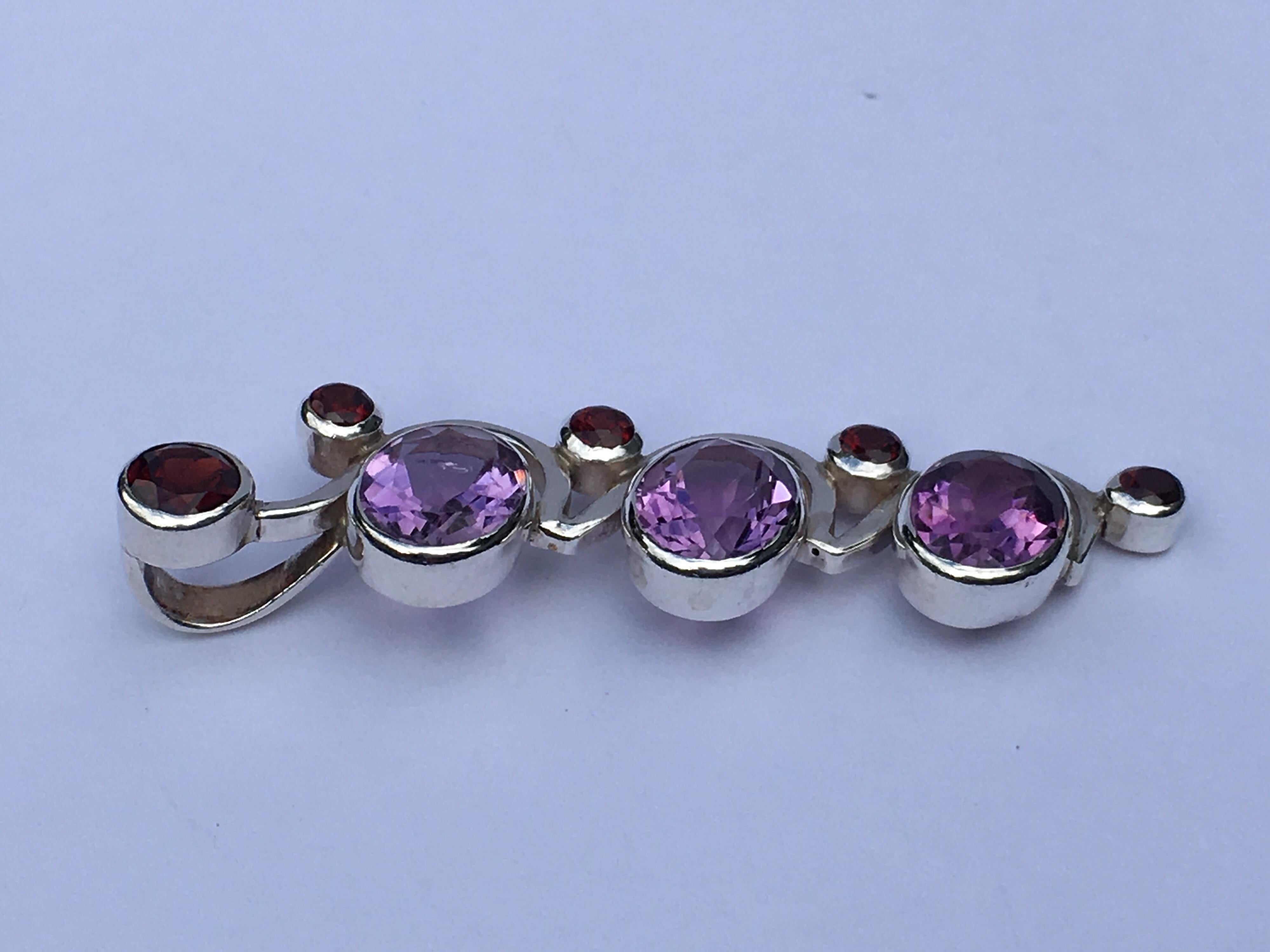 Oval Cut Amethyst and Garnet Pendant Set in Sterling Silver For Sale