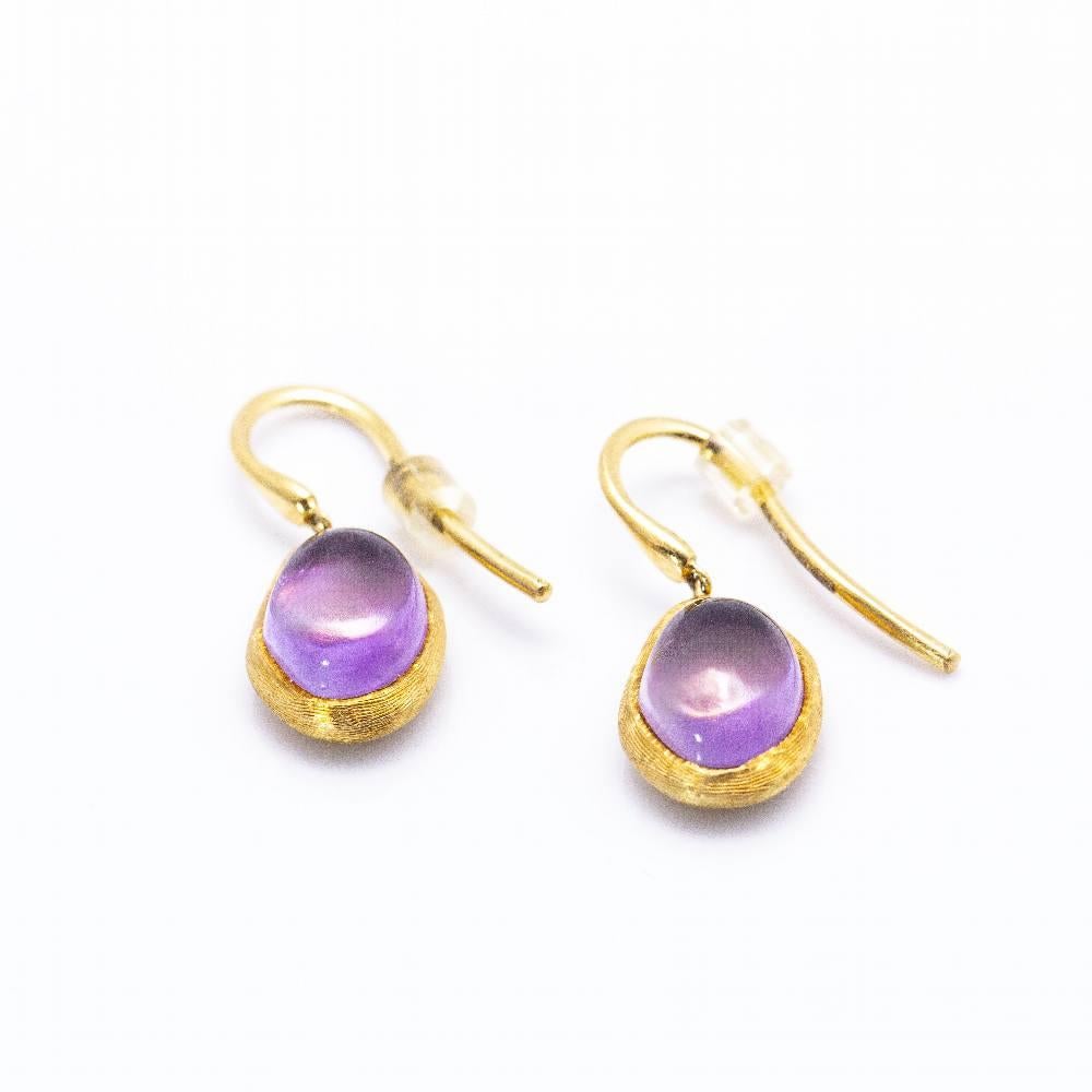 Earrings by Italian designer Marco Bicego in Gold and Amethysts for women : 1x Amethyst in 10mm cabochon cut : No clasp : 18kt Yellow Gold : 5,02 grams : Measures: Length 1,5cm : Brand new product : Ref:D360363CS