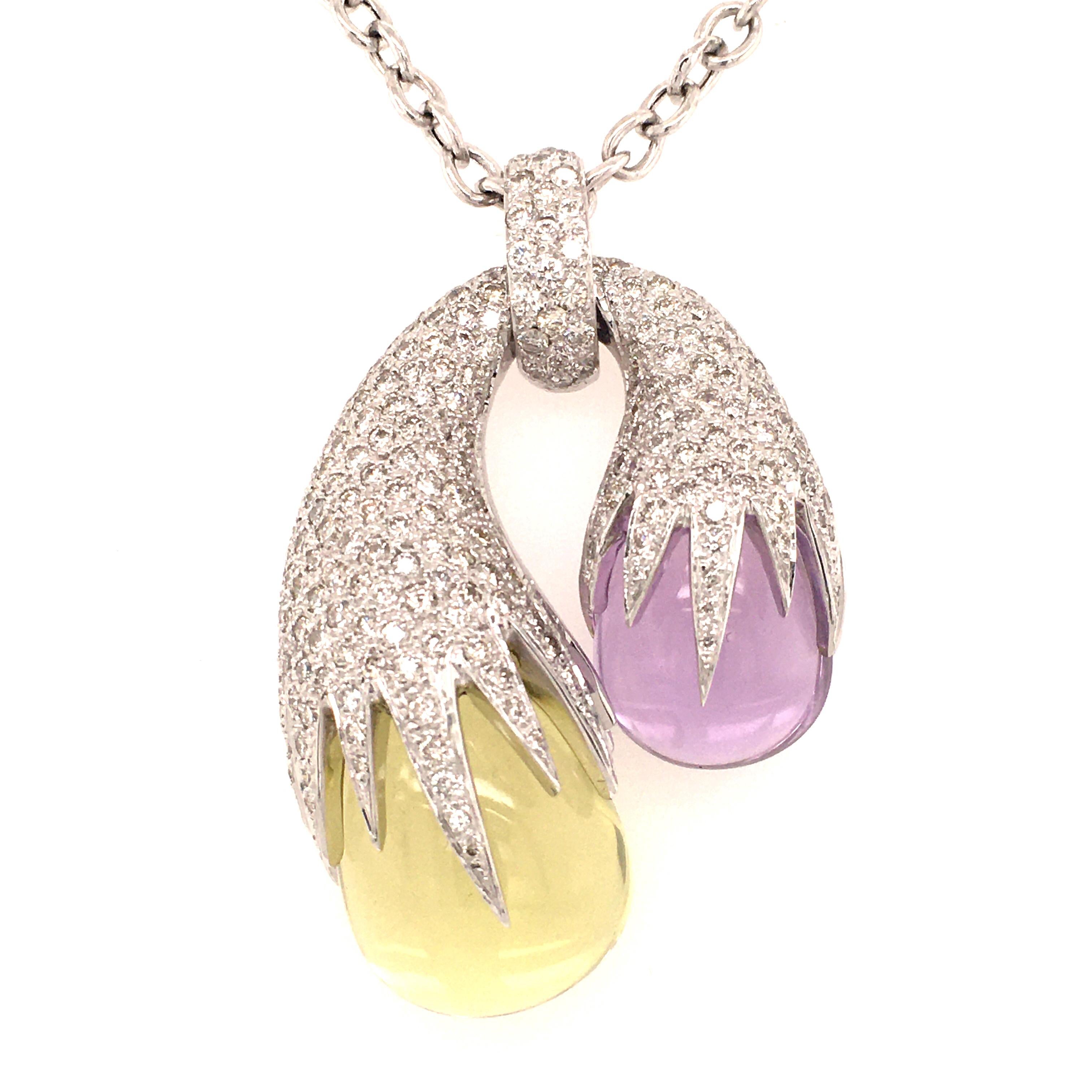 Unique modern pendant necklace in white gold 750, set with 1 polished amethyst and 1 polished lemon quartz, covered with brilliant cut diamonds totaling approx. 4 ct of G/H-vs quality. Nice anchor chain in white gold with lobster clasp. We carry