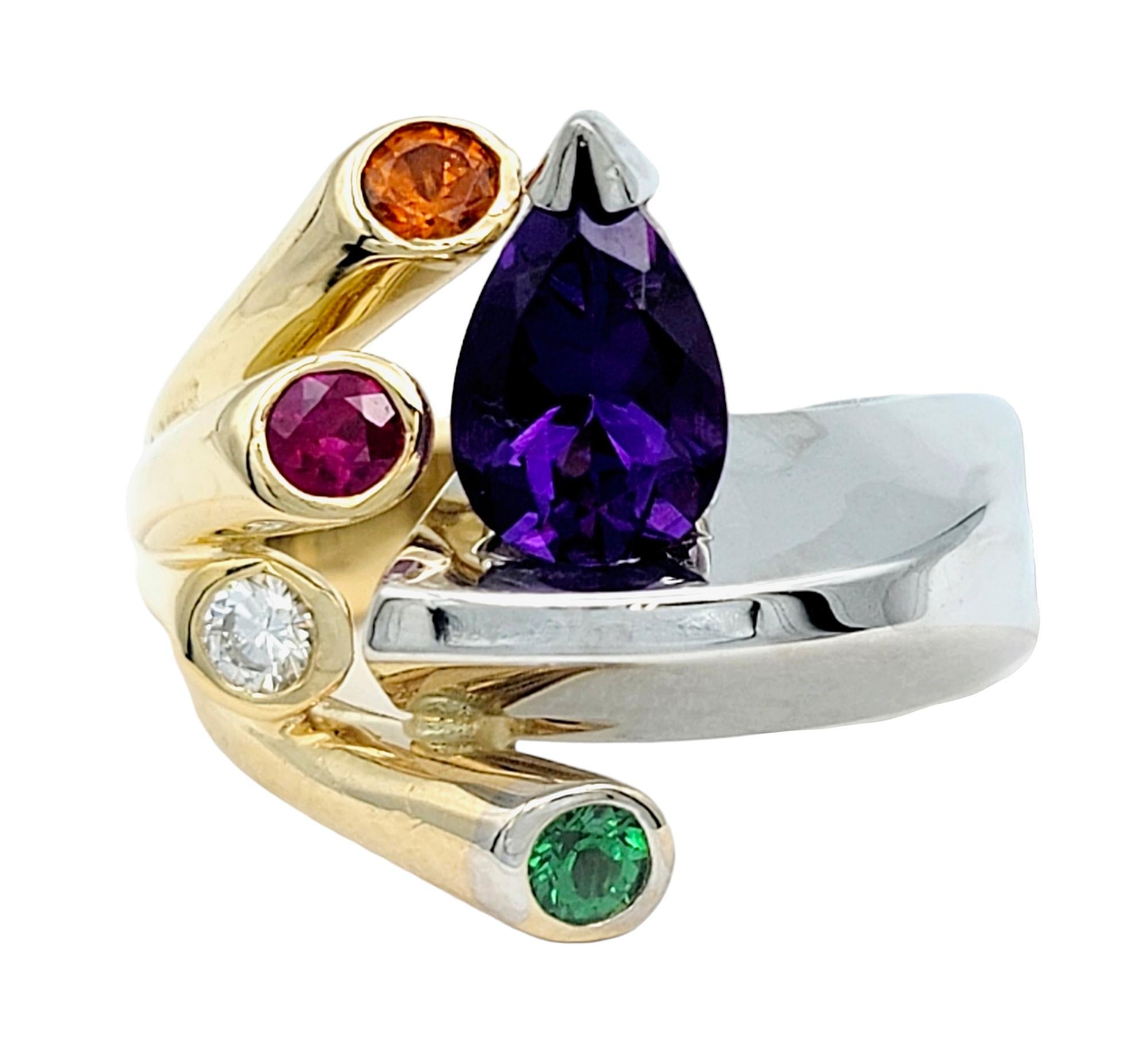 Ring Size: 6

This captivating cocktail ring is a striking embodiment of bold color and a uniquely modern design. Crafted in fine 14 karat gold, this masterpiece seamlessly marries the opulent luster of white and yellow gold, creating a stunning