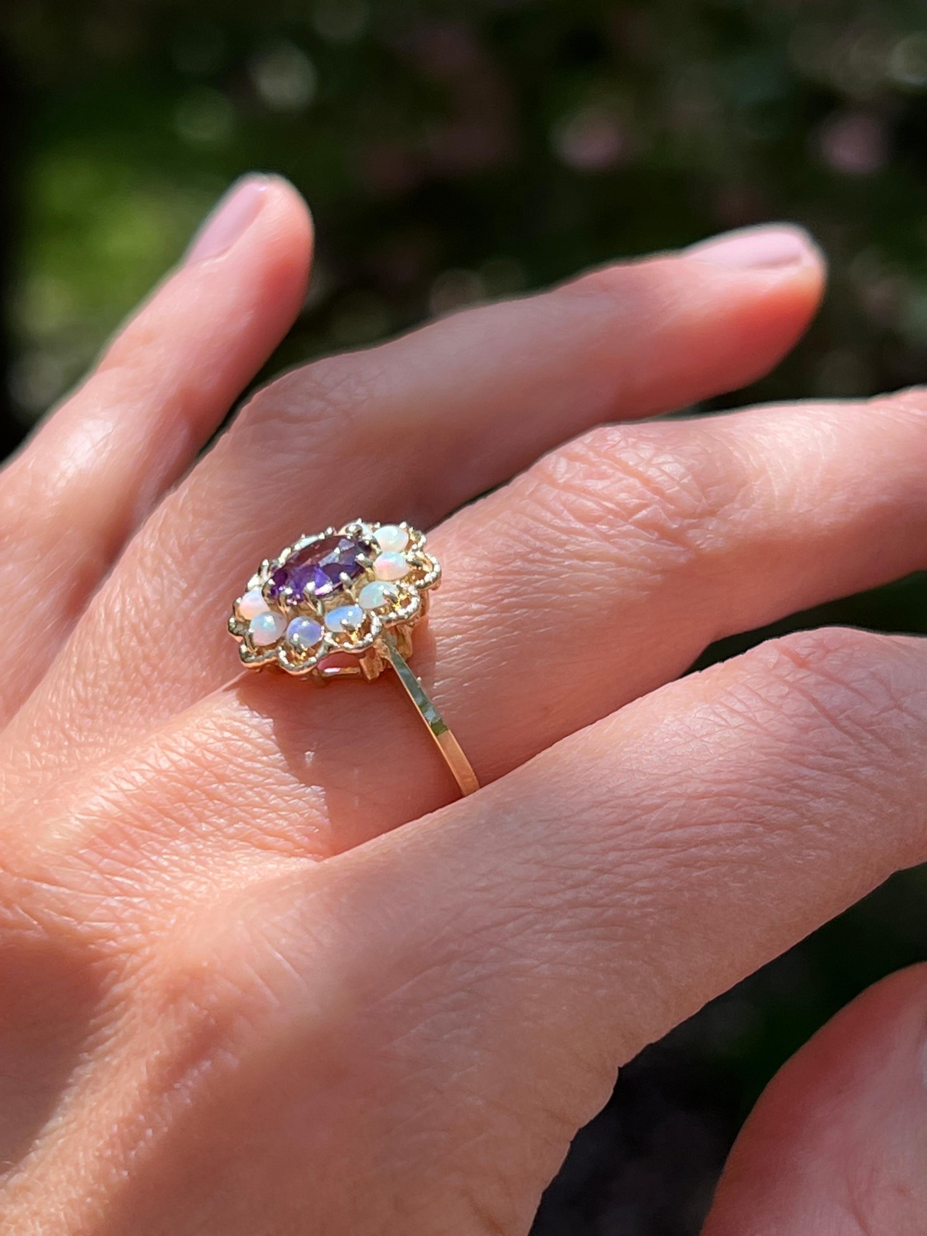 Oval Cut Amethyst and Opal Ring in 14 Karat Gold