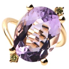 Anello in oro rosa con ametista e peridoto di Alexander Leyser