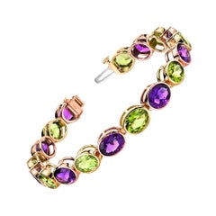 Pulsera de amatista y peridoto en oro blanco y rosa