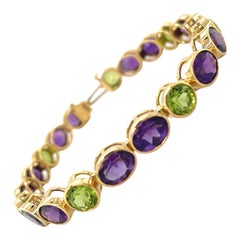 Tennis-Gliederarmband mit 22,84 Karat Amethyst und 10,84 Karat Peridot