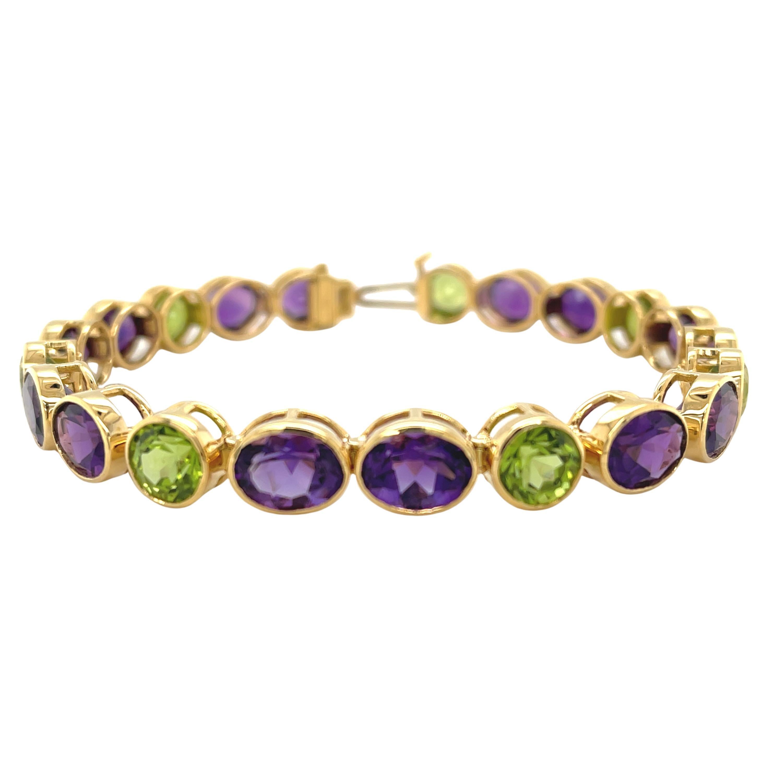 Pulsera de tenis de oro amarillo engastada con amatista y peridoto en venta